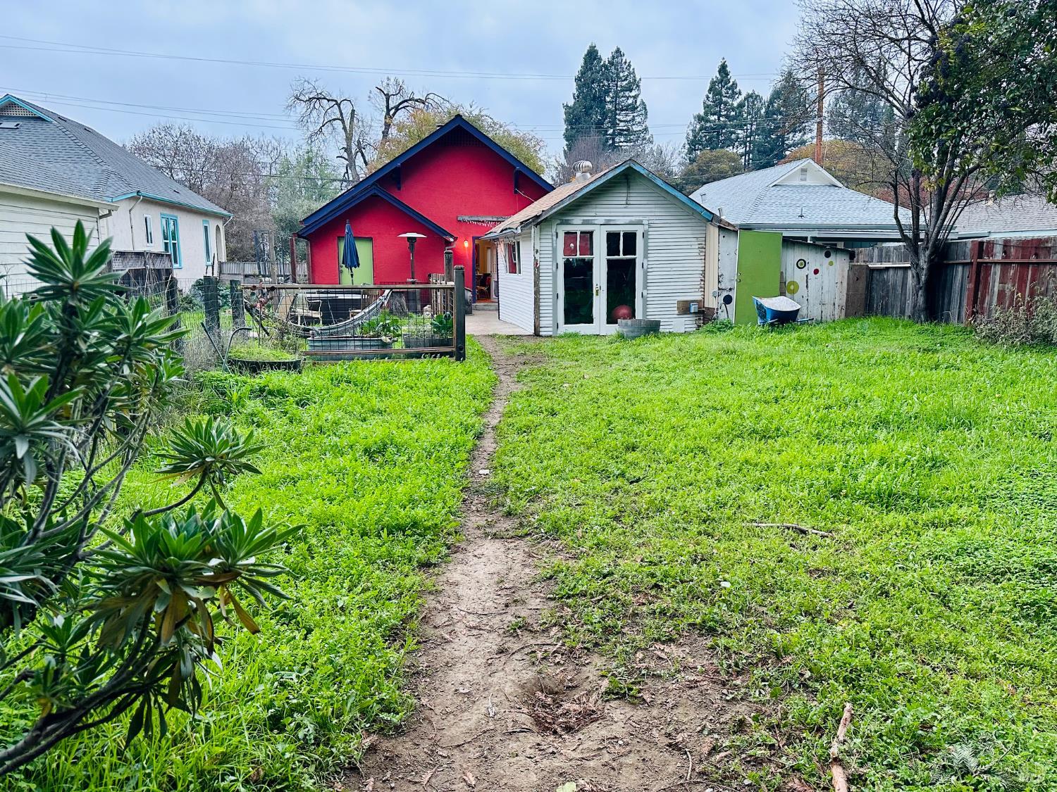 108 Pierson Street Santa Rosa, CA 95401 - Photo 30 of 33 a view of a big yard in front of a brick house with large windows