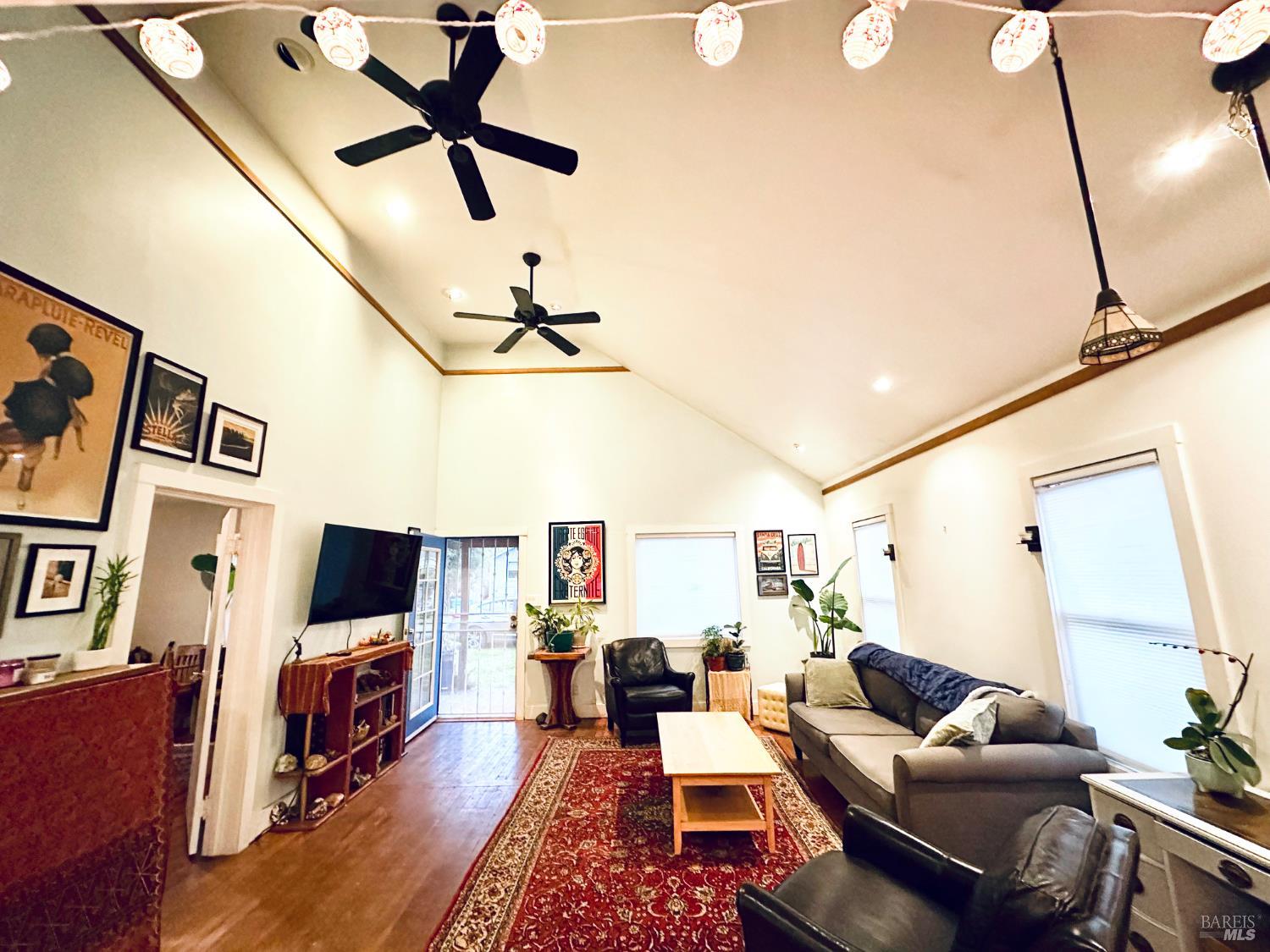 108 Pierson Street Santa Rosa, CA 95401 - Photo 4 of 33 a living room with furniture a flat screen tv and a window