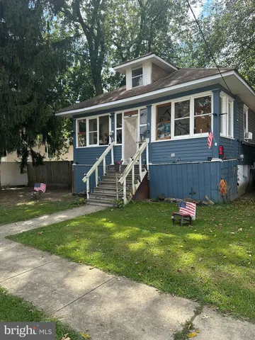 a house view with a sitting space garden