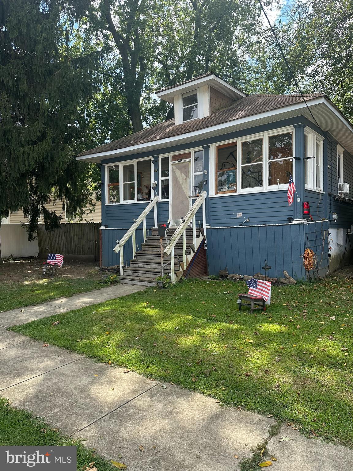 a house view with a sitting space garden