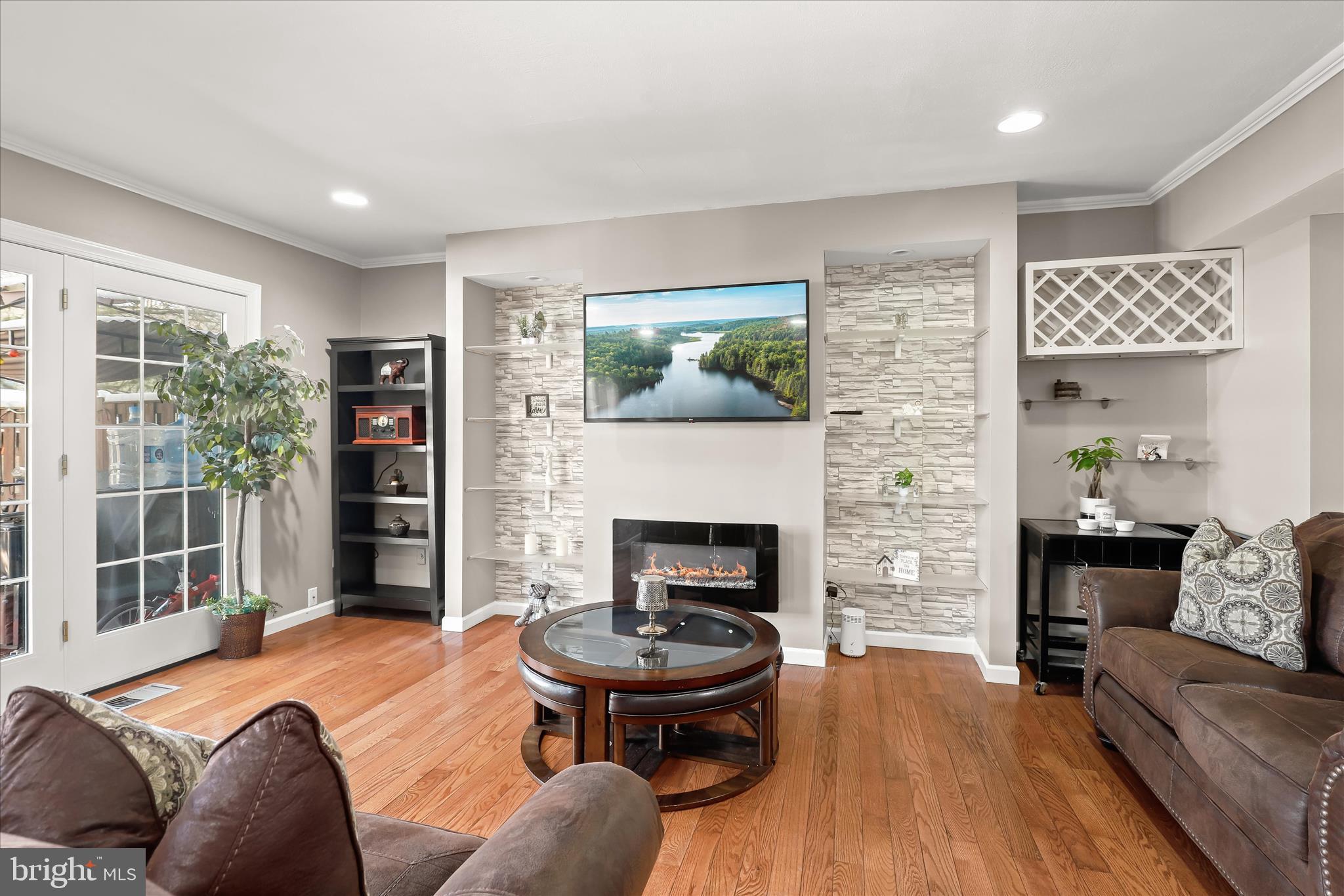 10 Ramsdell Terrace Gaithersburg, MD 20878 - Photo 9 of 40 Custom accent wall with shelving & fireplace