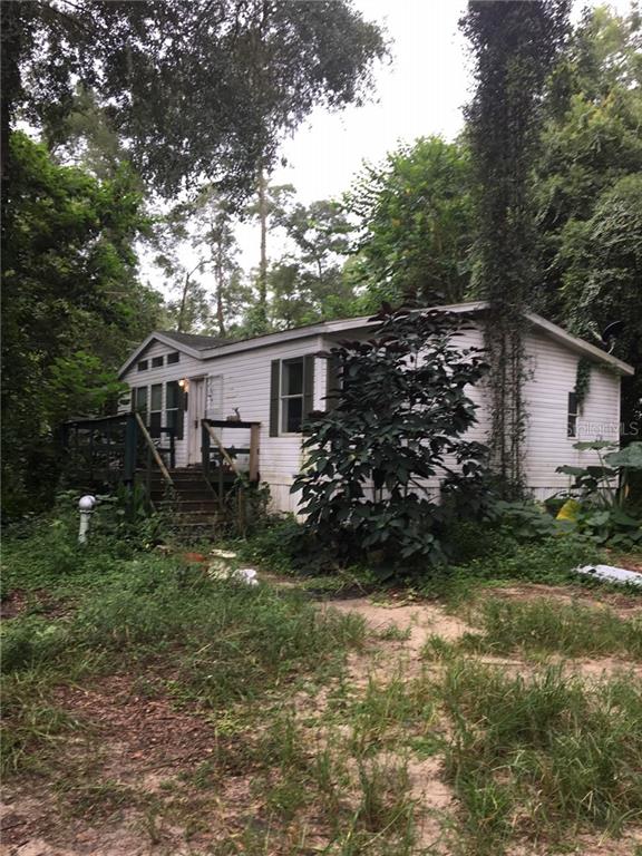 3820 Southwest 80th Street Ocala, FL 34476 - Photo 1 of 1 a view of a house with backyard and garden