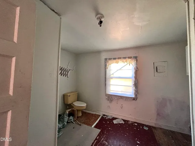 a room with a window and gym equipment