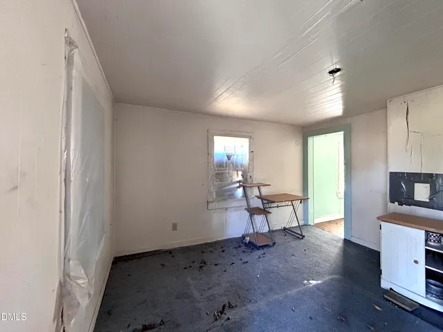 a view of a livingroom with furniture and windows
