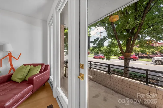 a view of balcony with couch and wooden floor
