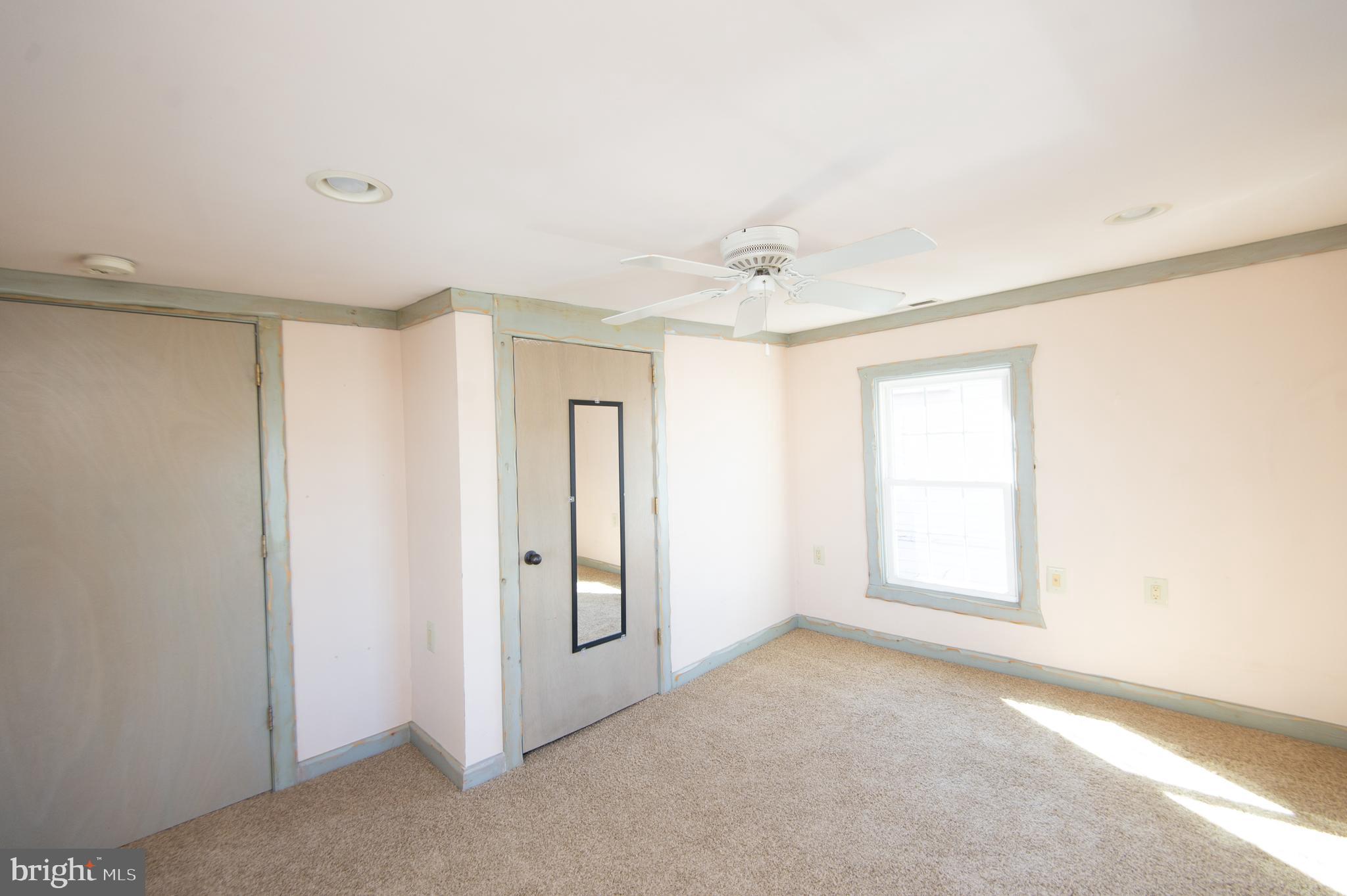 102 Hayward Street Cambridge, MD 21613 - Photo 24 of 35 an empty room with windows and closet