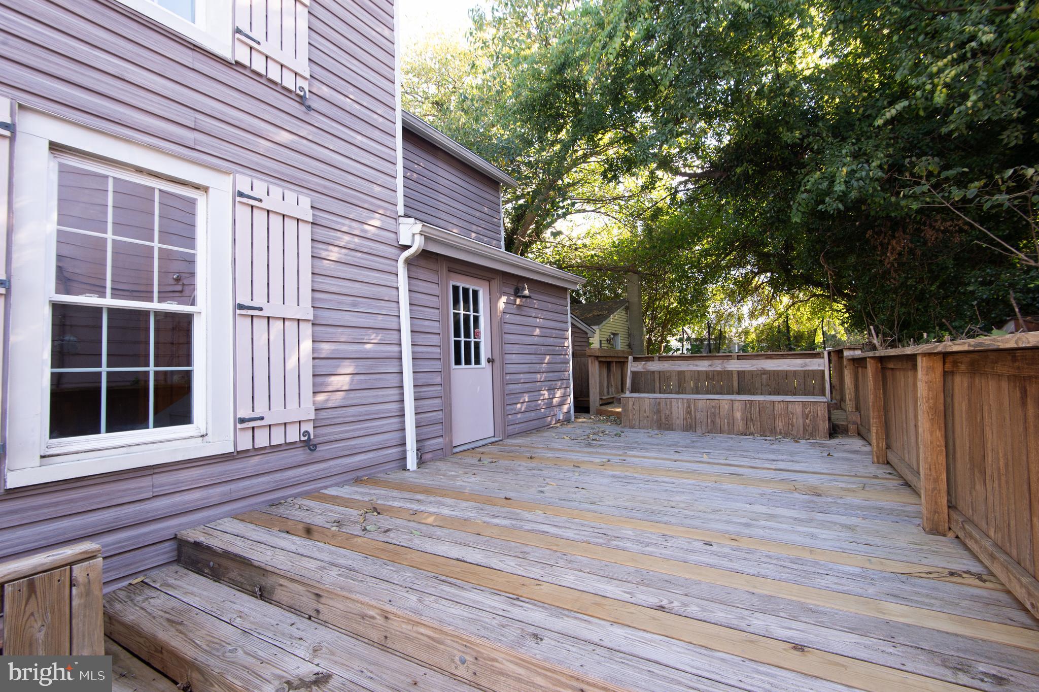 102 Hayward Street Cambridge, MD 21613 - Photo 29 of 35 a view of a house with a wooden deck
