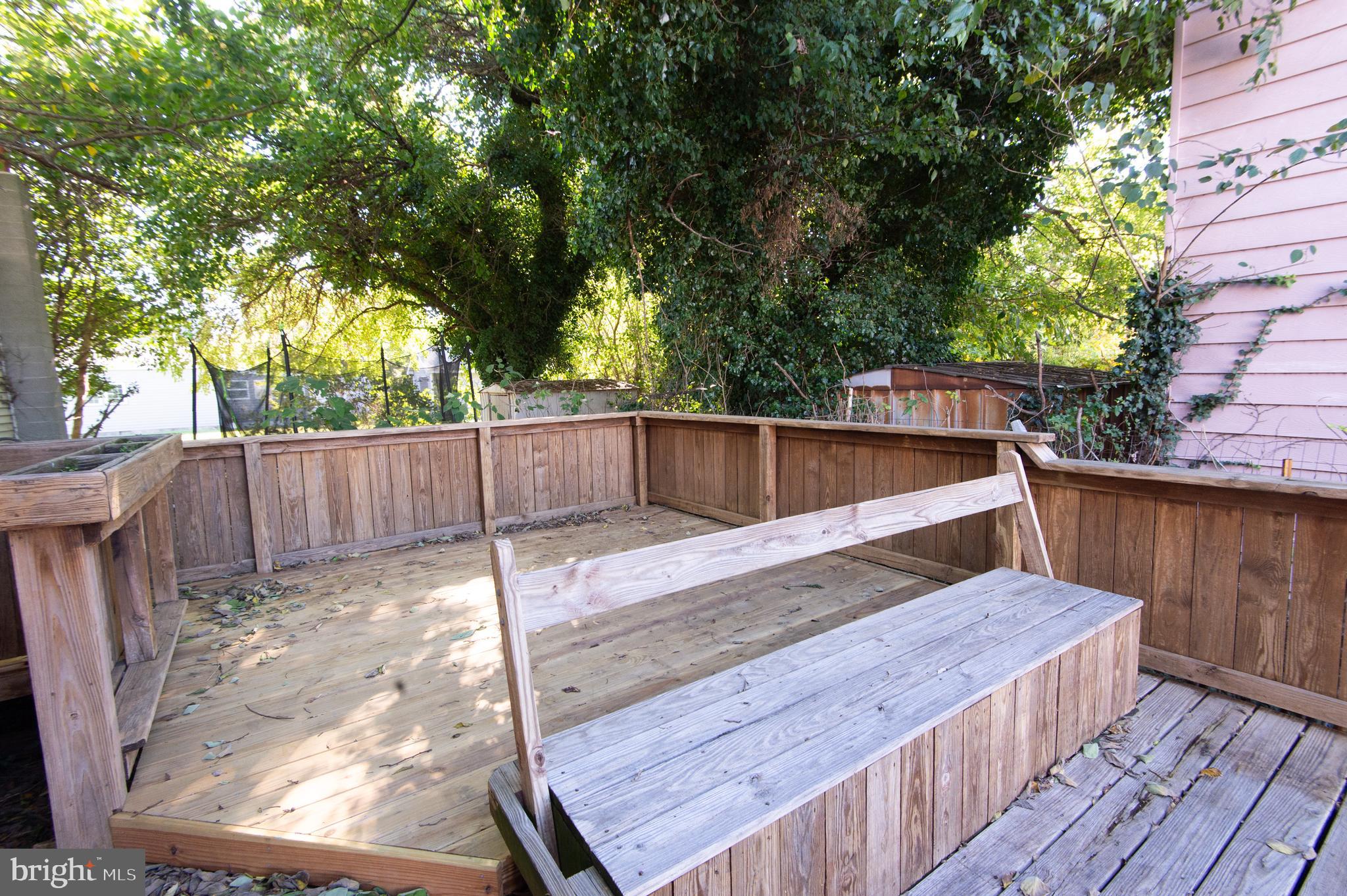 102 Hayward Street Cambridge, MD 21613 - Photo 31 of 35 a view of a wooden deck and a backyard