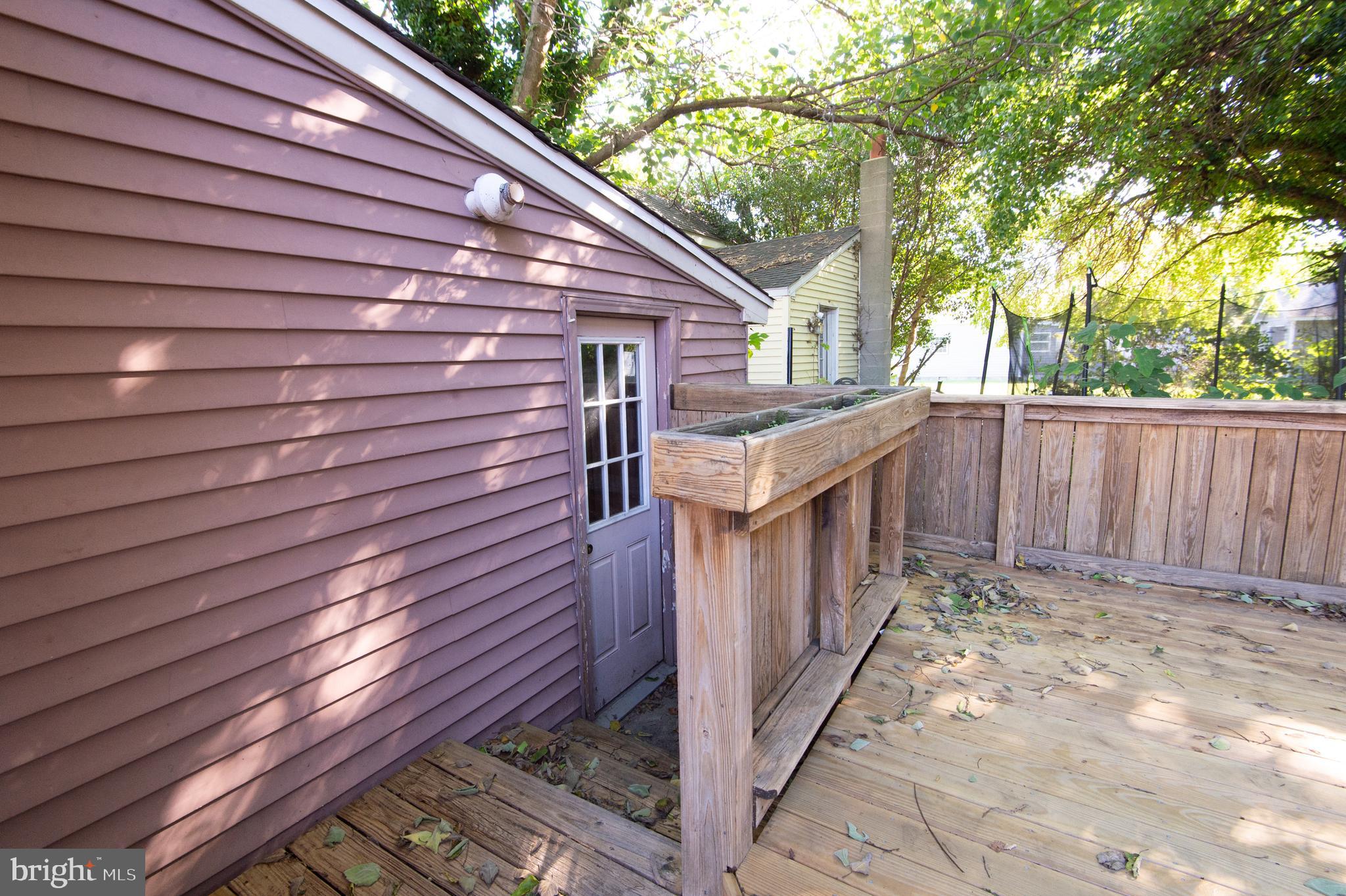 102 Hayward Street Cambridge, MD 21613 - Photo 32 of 35 a view of house with wooden fence