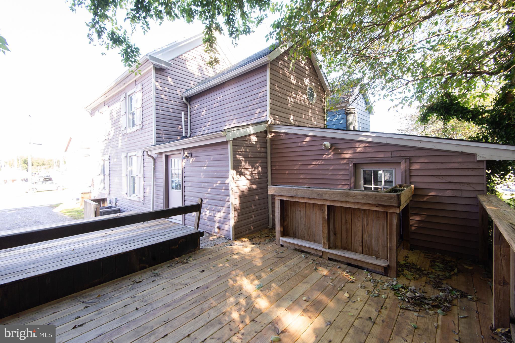 102 Hayward Street Cambridge, MD 21613 - Photo 33 of 35 a view of a deck with a fireplace and wooden floor