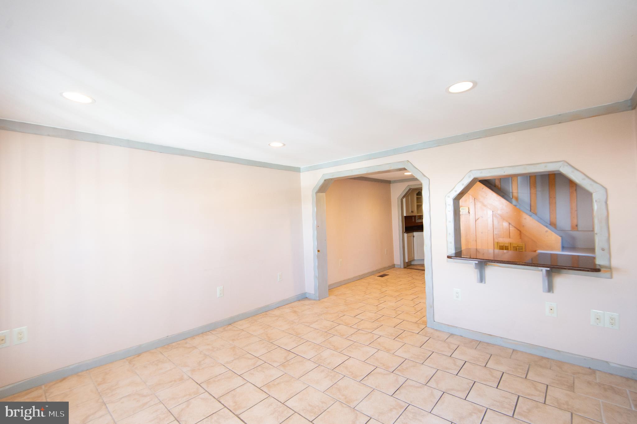 102 Hayward Street Cambridge, MD 21613 - Photo 4 of 35 a view of a room with cabinet and mirror