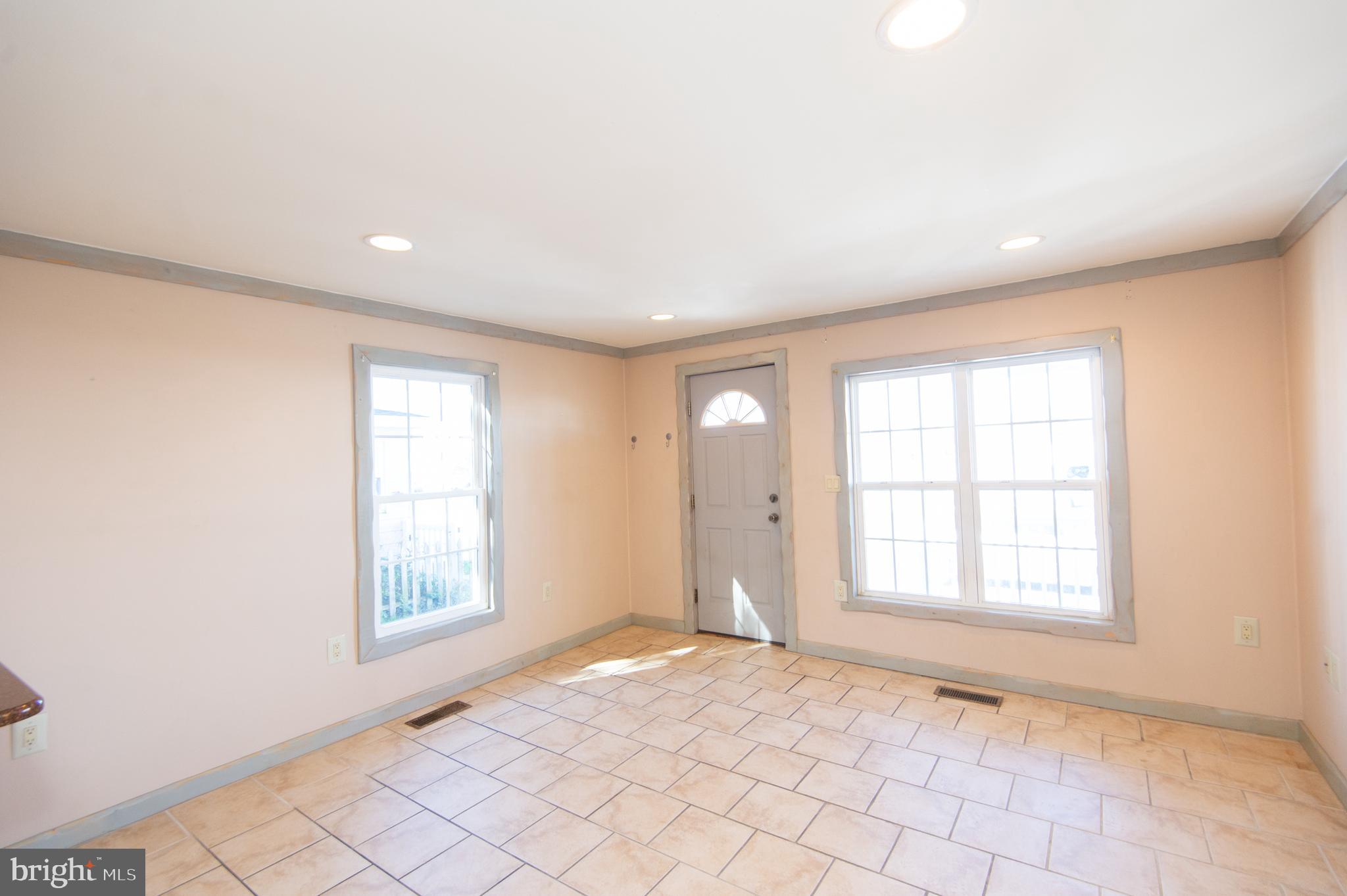 102 Hayward Street Cambridge, MD 21613 - Photo 6 of 35 an empty room with windows