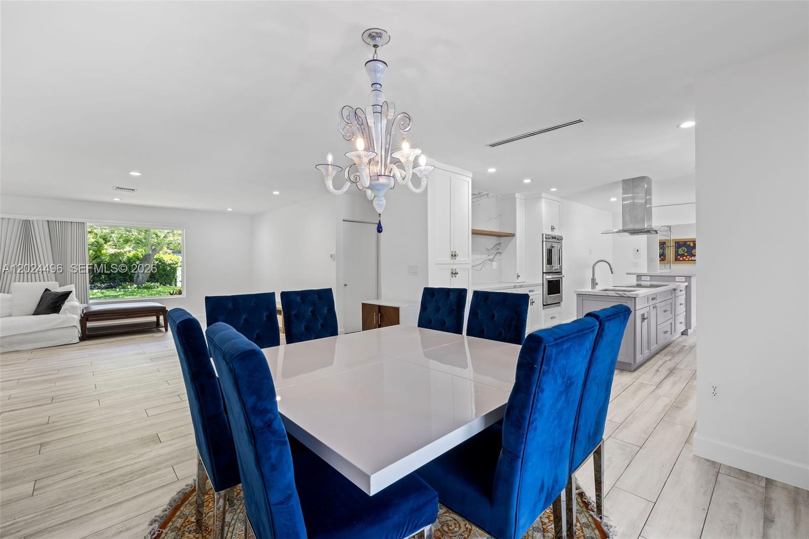 6875 North Cartee Road Palmetto Bay, FL 33158 - Photo 9 of 42 a view of a dining room with furniture and wooden floor