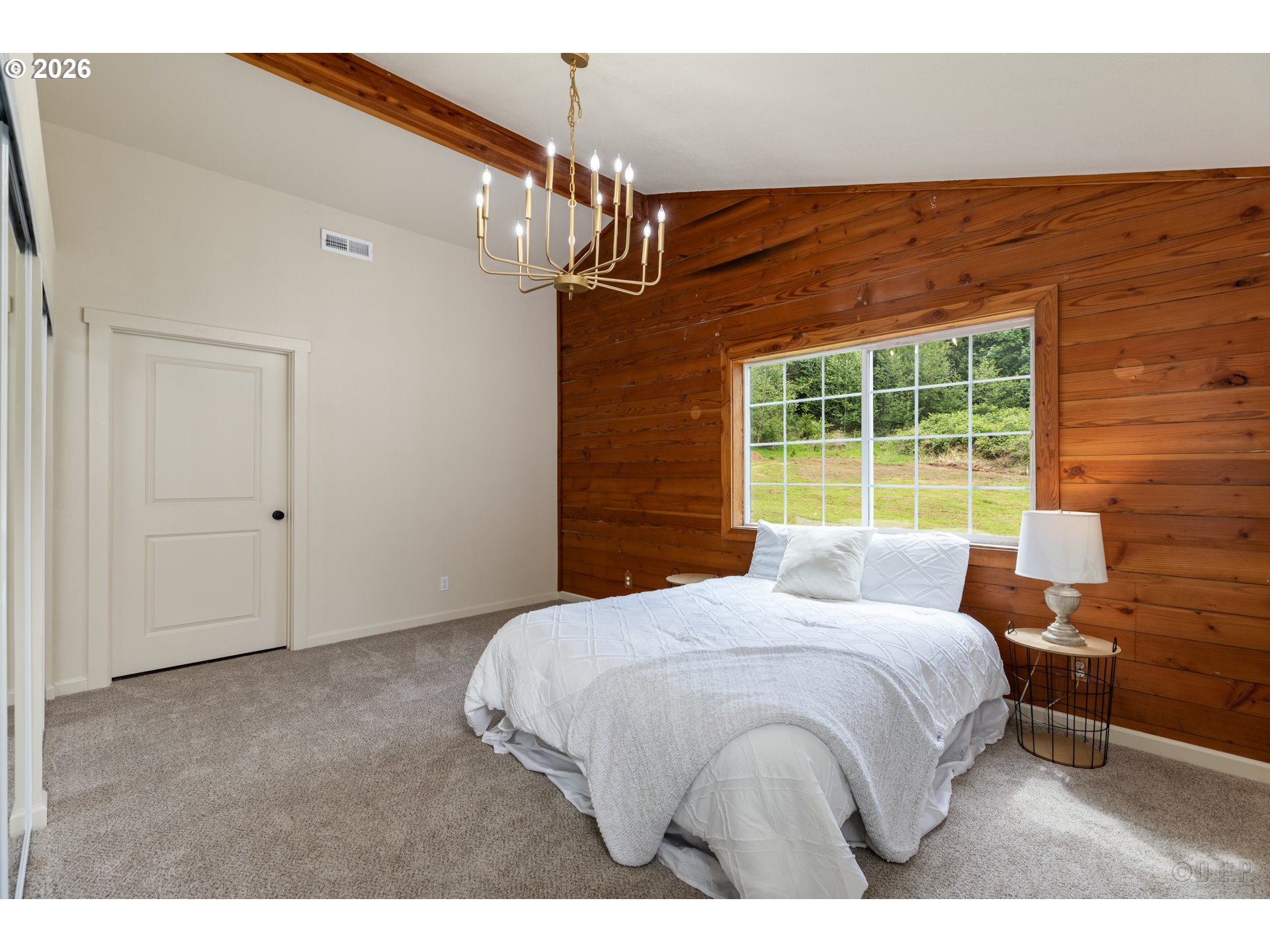 29234 Thistle Hill Road Rainier, OR 97048 - Photo 12 of 33 a bedroom with a bed and a window