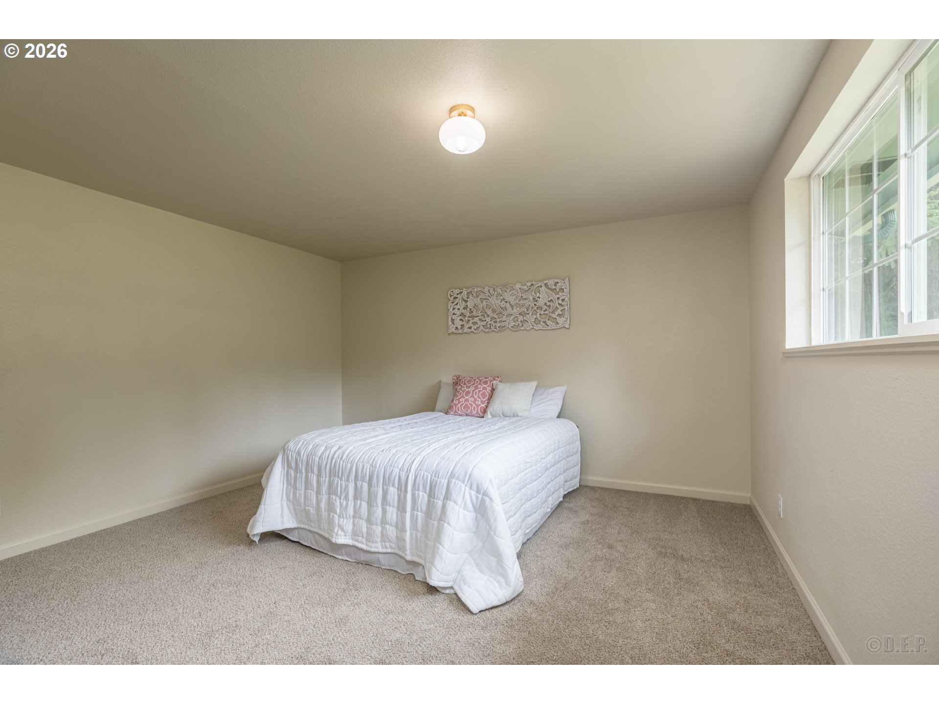 29234 Thistle Hill Road Rainier, OR 97048 - Photo 17 of 33 a bedroom with a bed and a window