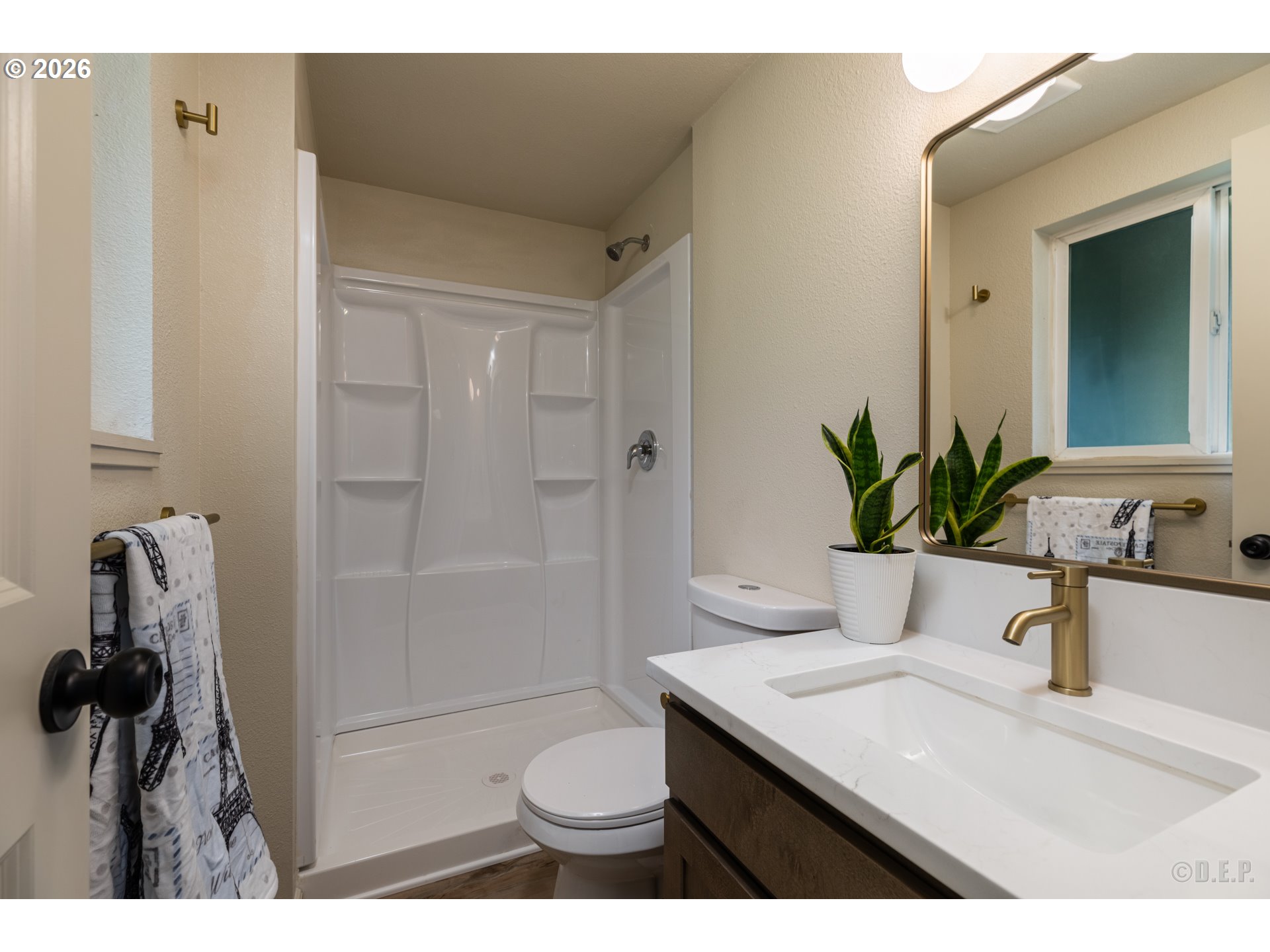 29234 Thistle Hill Road Rainier, OR 97048 - Photo 18 of 33 a bathroom with a sink a toilet a mirror and shower