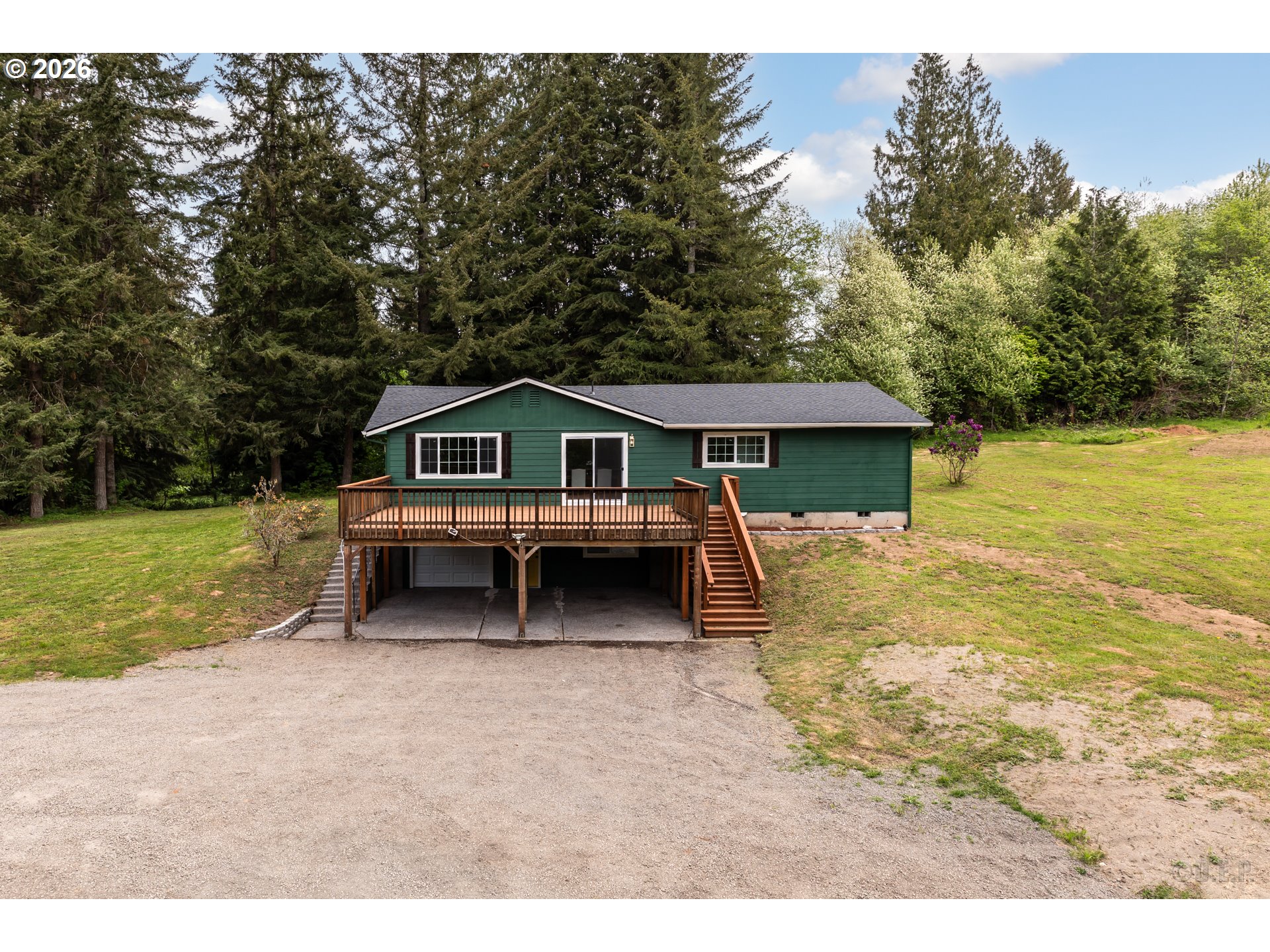 29234 Thistle Hill Road Rainier, OR 97048 - Photo 27 of 33 a house with trees in the background