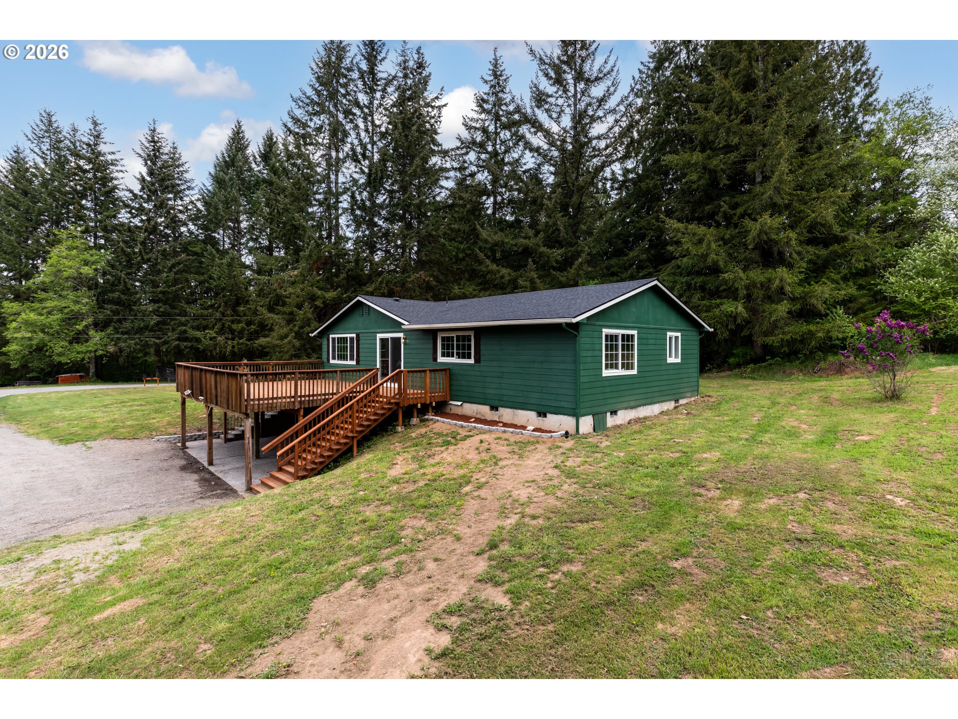 29234 Thistle Hill Road Rainier, OR 97048 - Photo 30 of 33 a view of house with backyard and outdoor seating