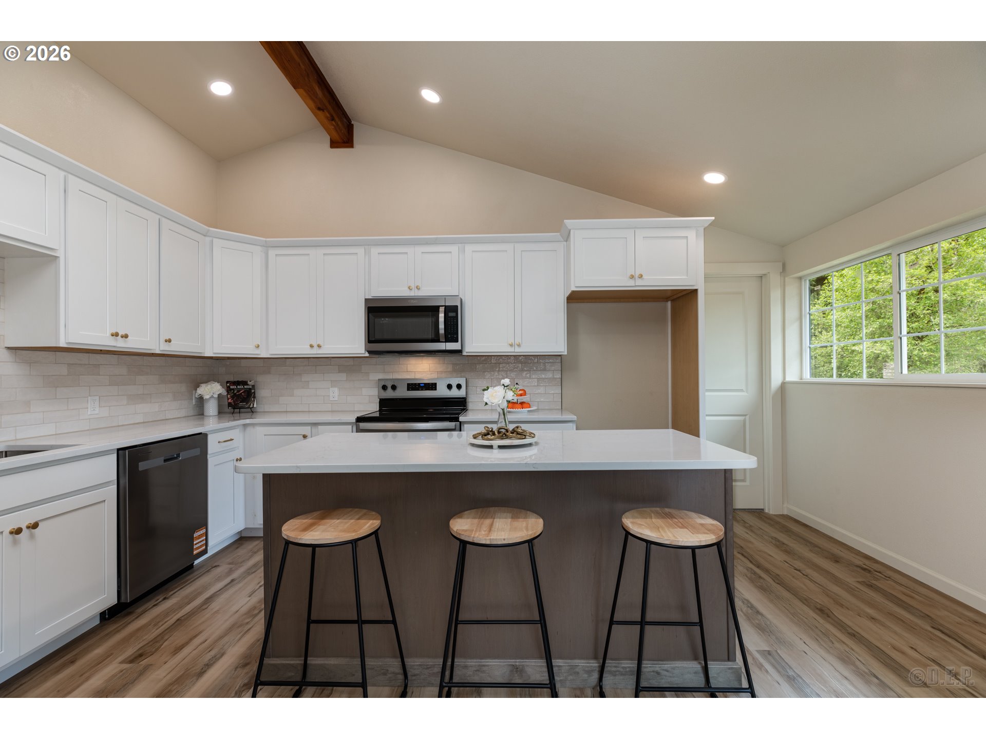 29234 Thistle Hill Road Rainier, OR 97048 - Photo 7 of 33 a kitchen with kitchen island a dining table and chairs