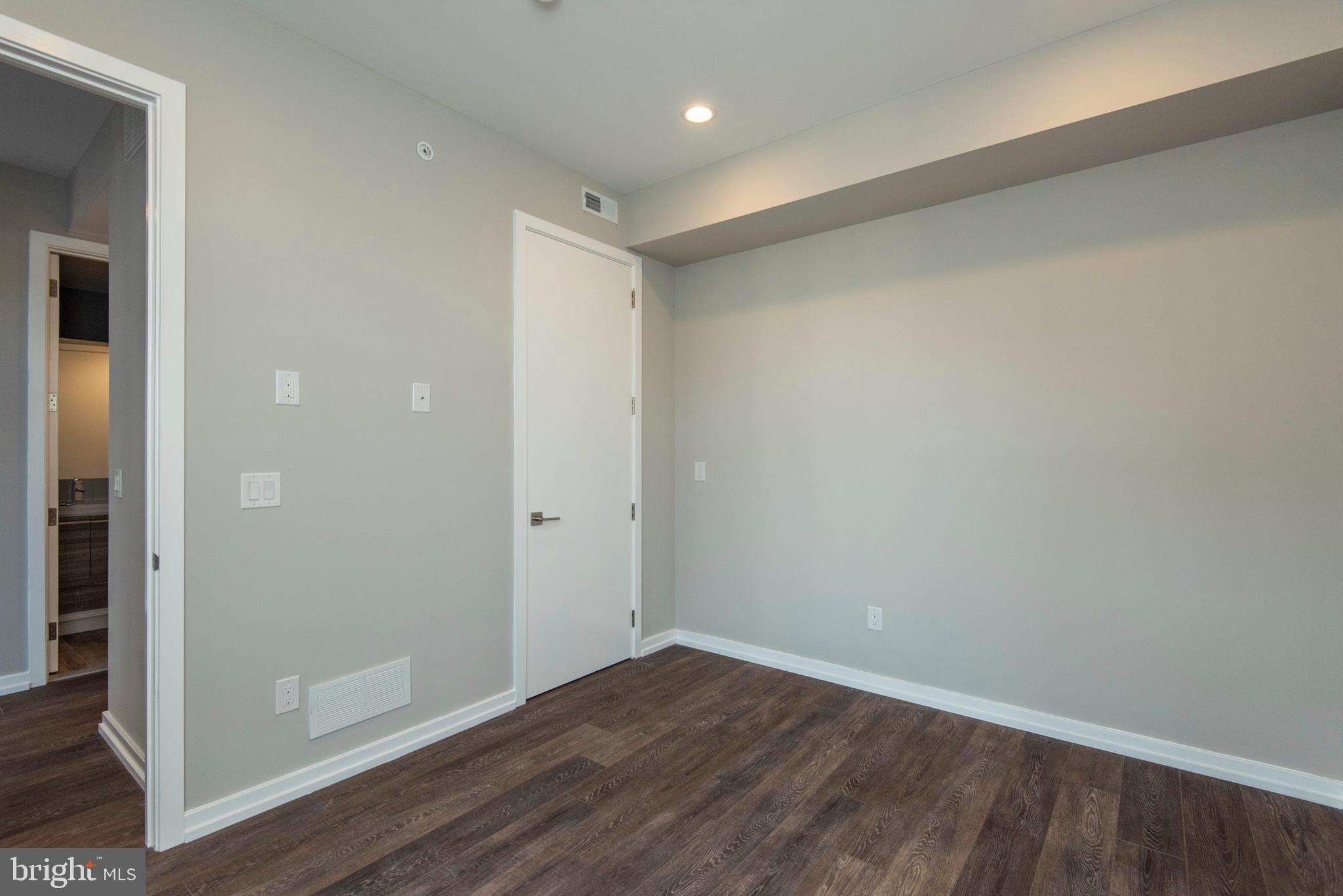 1340 South 13th Street, Unit 3B Philadelphia, PA 19147 - Photo 25 of 31 wooden floor in an empty room