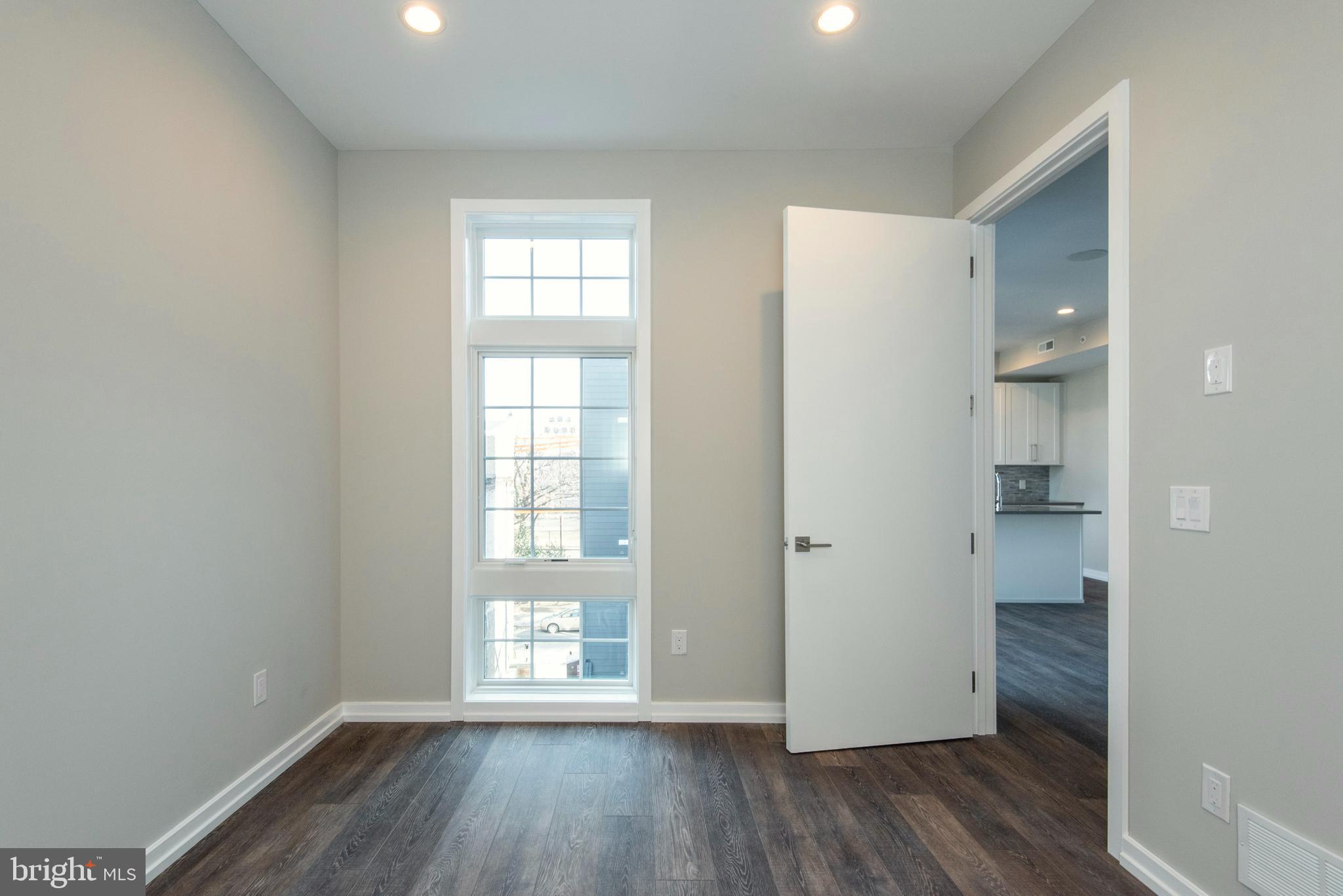 1340 South 13th Street, Unit 3B Philadelphia, PA 19147 - Photo 31 of 31 a view of empty room with wooden floor and fan