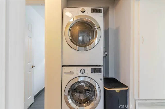 a view of a hallway with washer and dryer