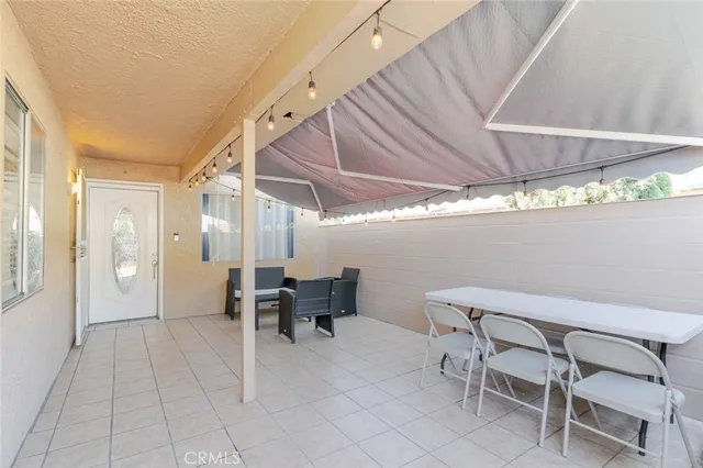 a view of dining room with furniture and window