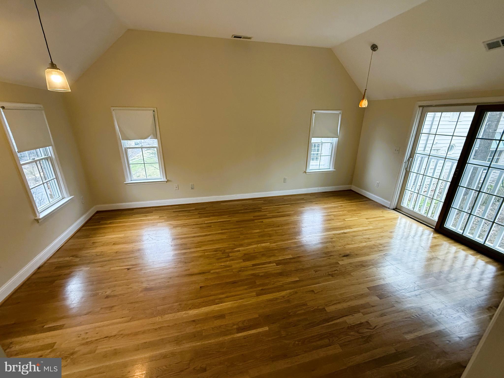 3202 Rolling Road Chevy Chase, MD 20815 - Photo 18 of 43 a view of an empty room with window and wooden floor