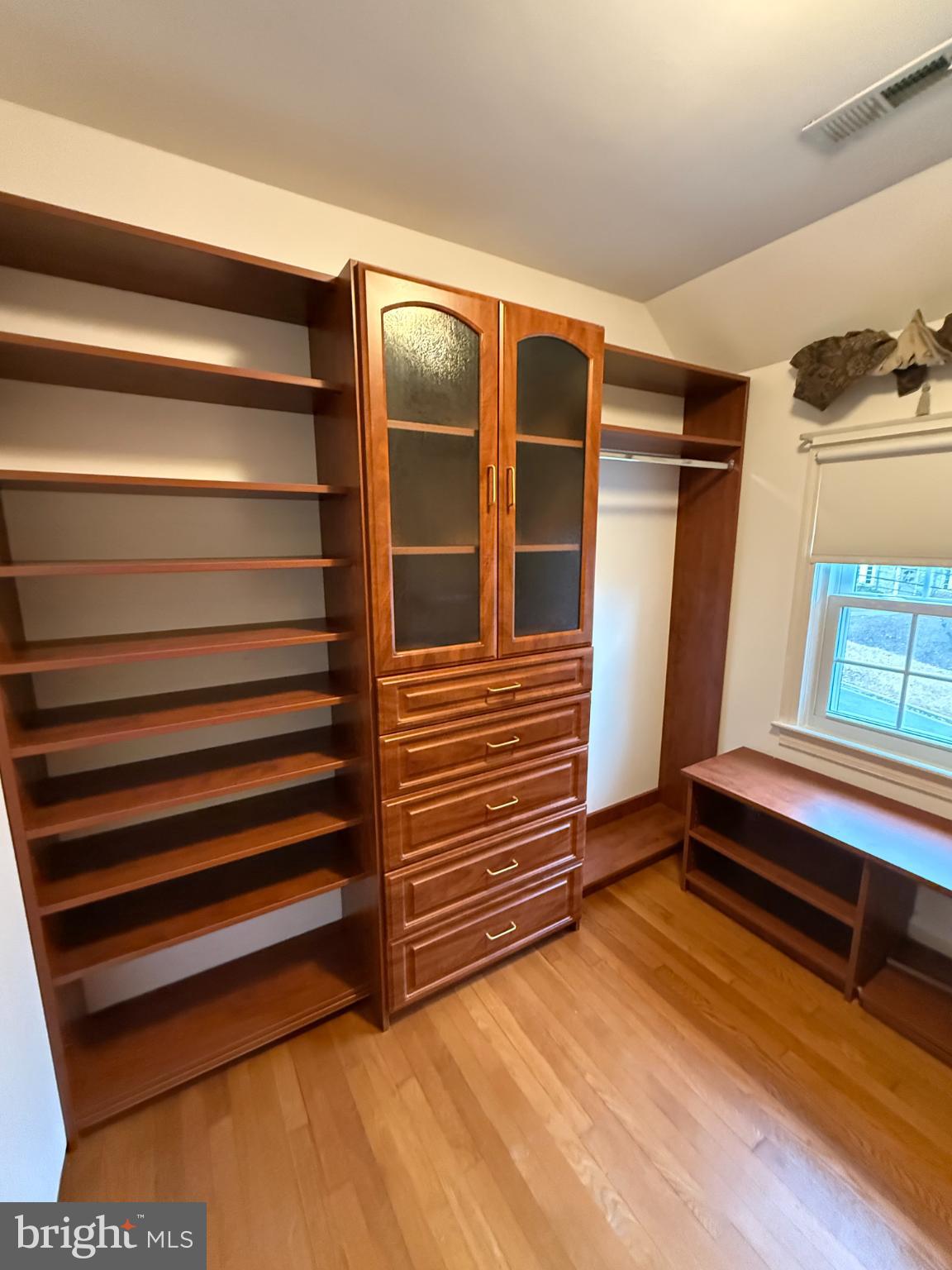 3202 Rolling Road Chevy Chase, MD 20815 - Photo 22 of 43 a view of walk in closet with clothes and shoes