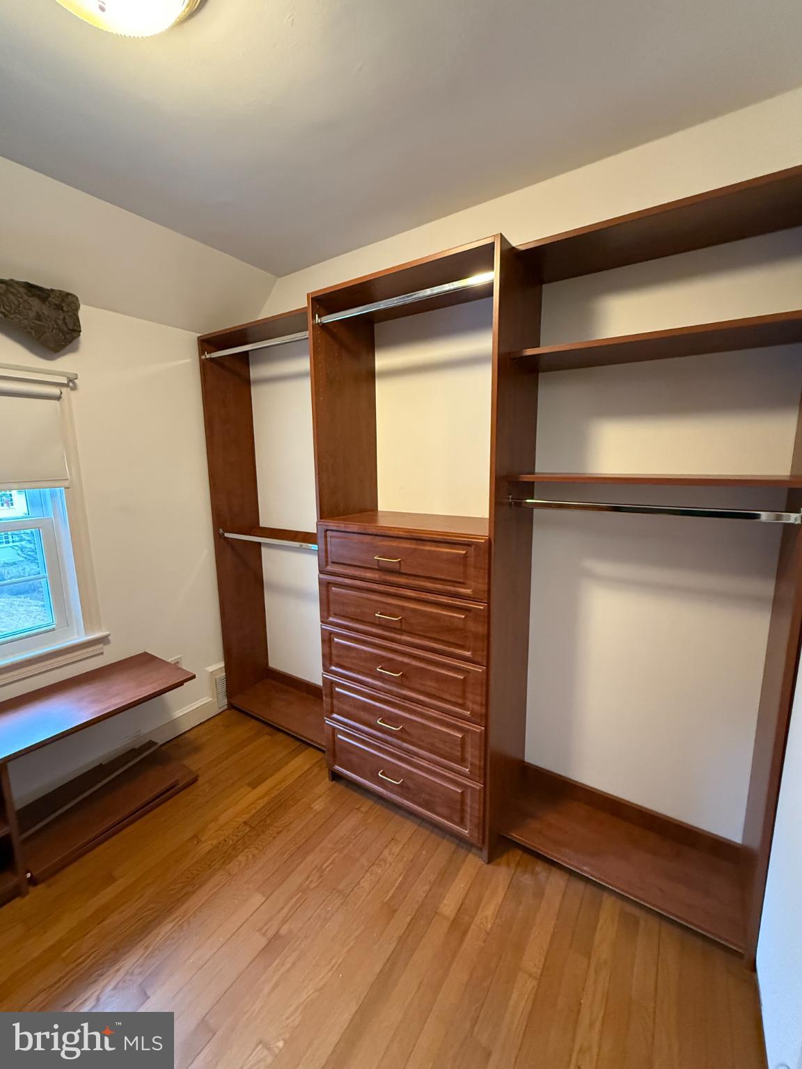 3202 Rolling Road Chevy Chase, MD 20815 - Photo 23 of 43 a view of walk in closet with empty racks