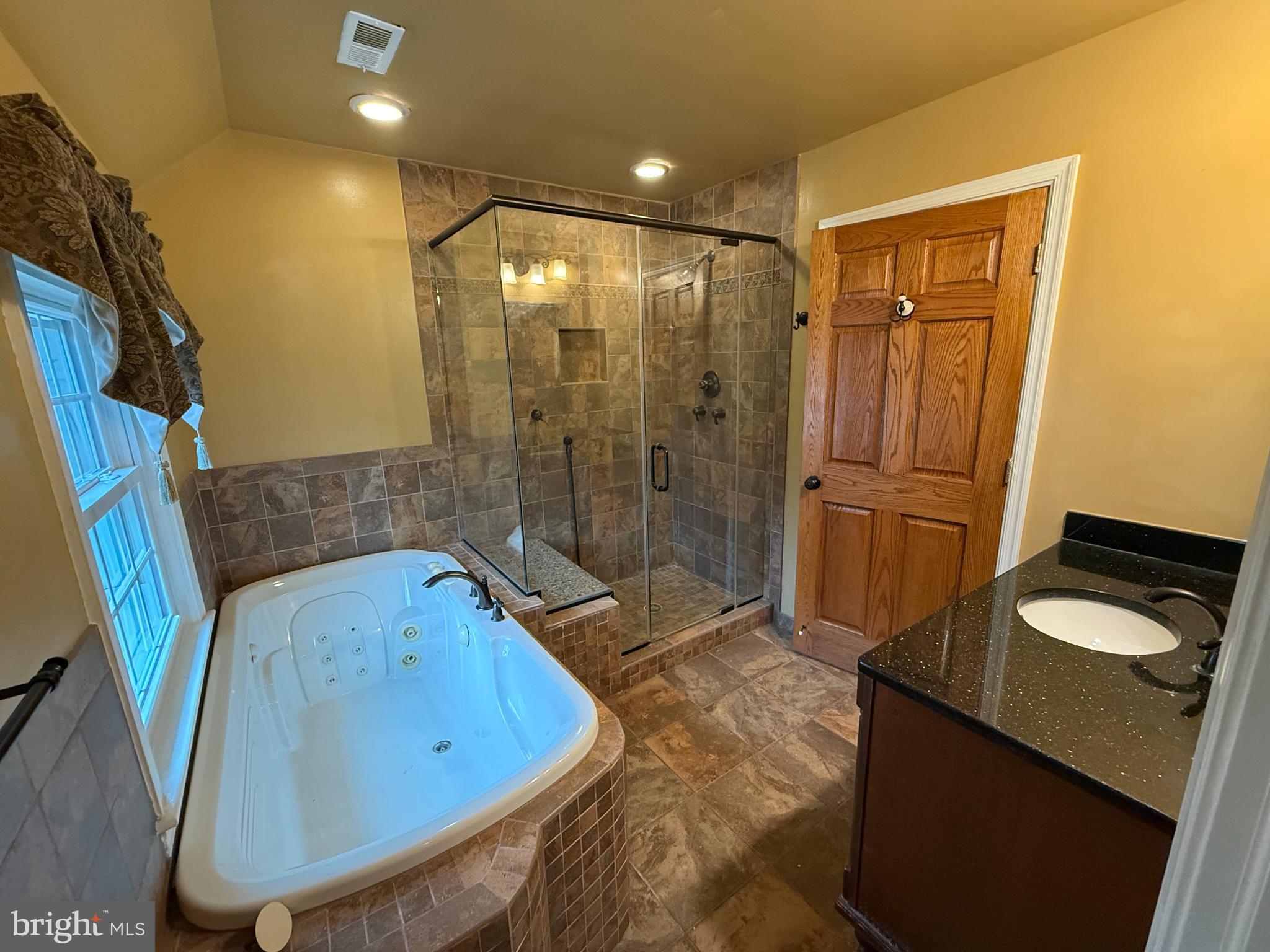 3202 Rolling Road Chevy Chase, MD 20815 - Photo 24 of 43 a bathroom with a sink and a mirror