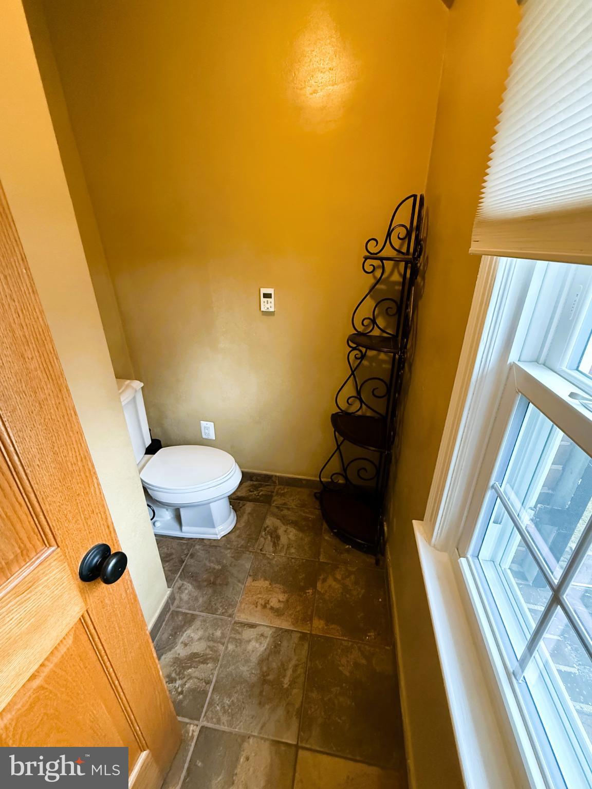 3202 Rolling Road Chevy Chase, MD 20815 - Photo 27 of 43 a bathroom with a sink and a toilet