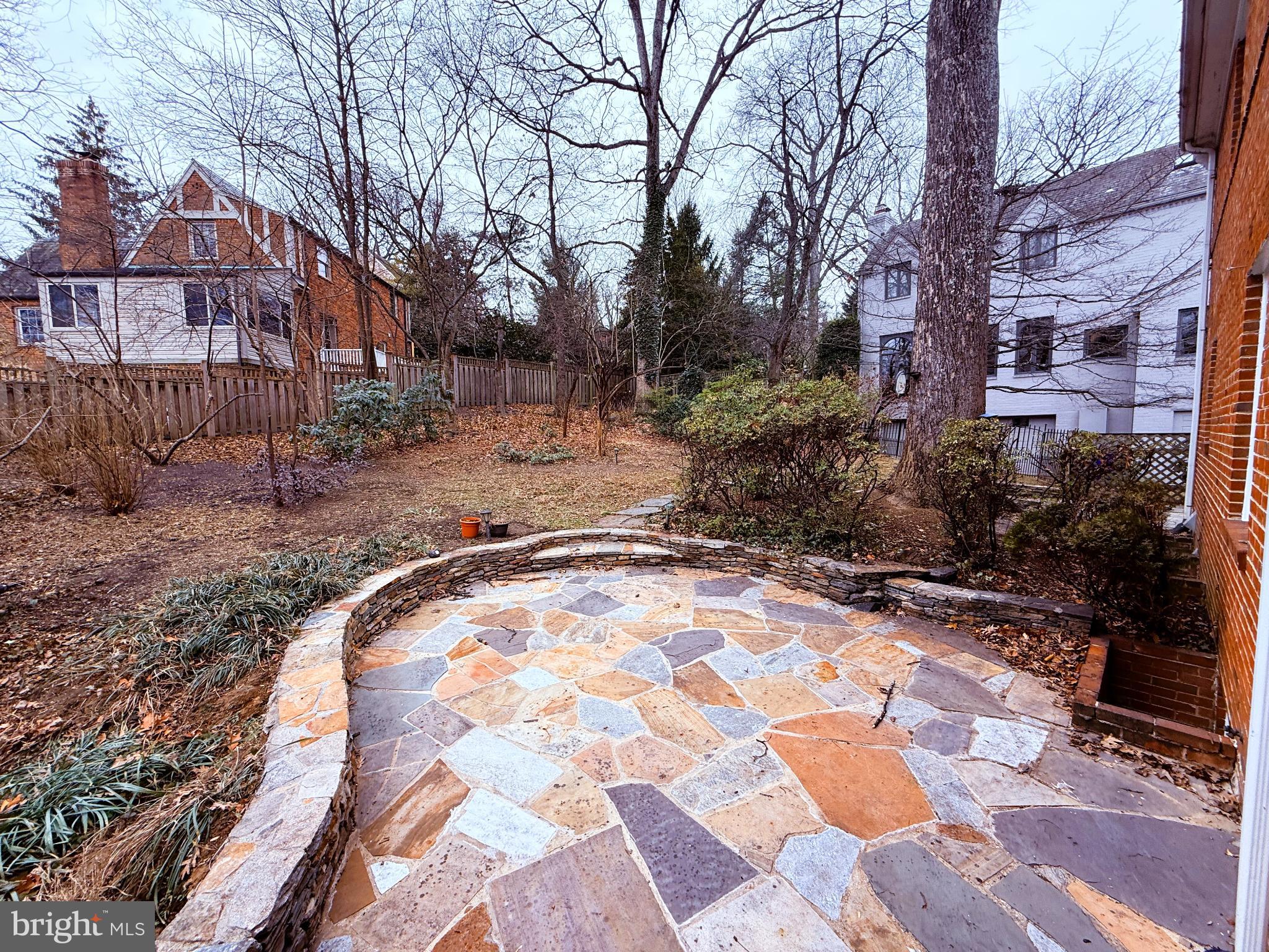3202 Rolling Road Chevy Chase, MD 20815 - Photo 4 of 43 a backyard of a house with yard and trampoline