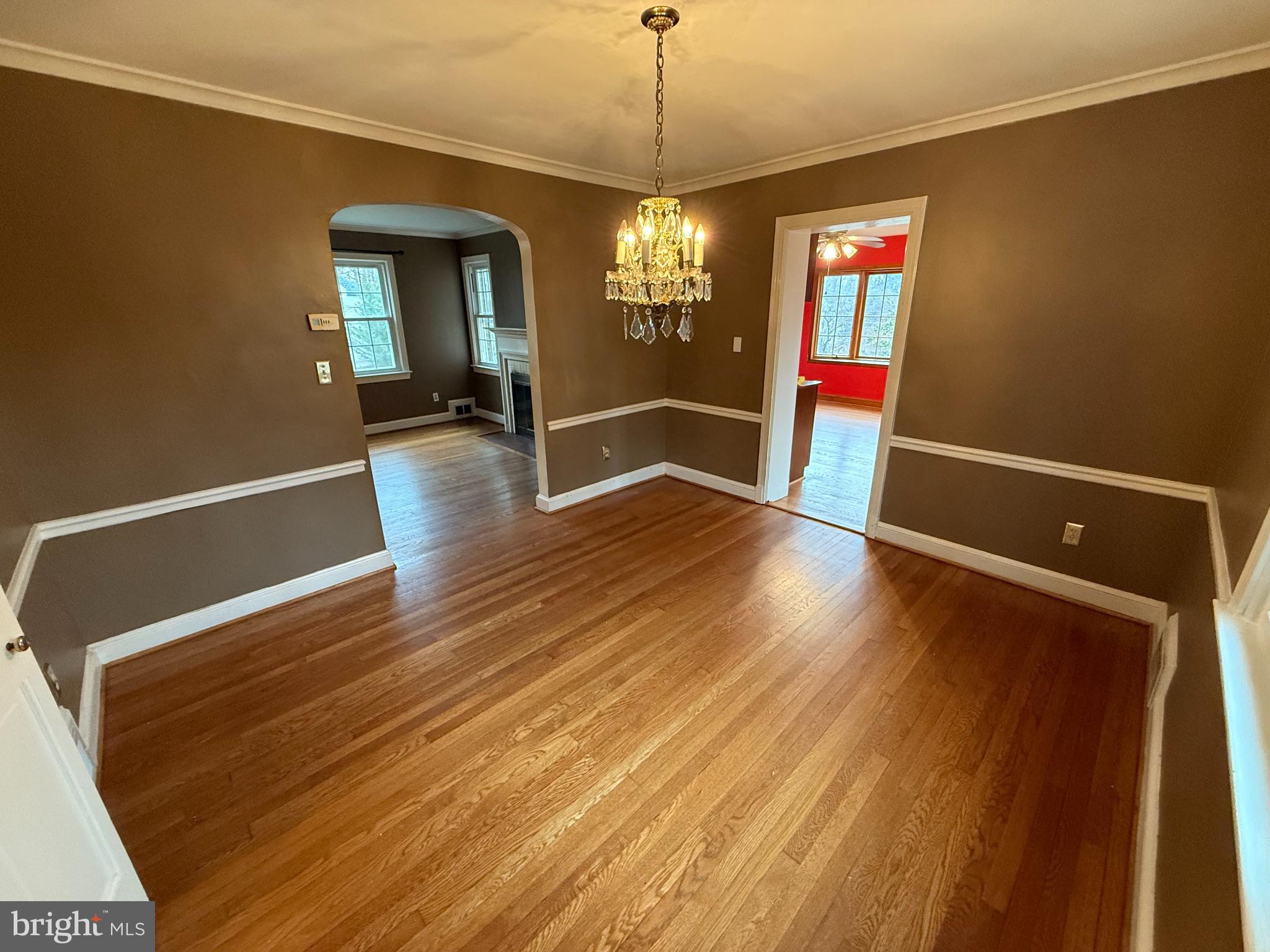 3202 Rolling Road Chevy Chase, MD 20815 - Photo 9 of 43 a view of a hallway with wooden floor and stairs