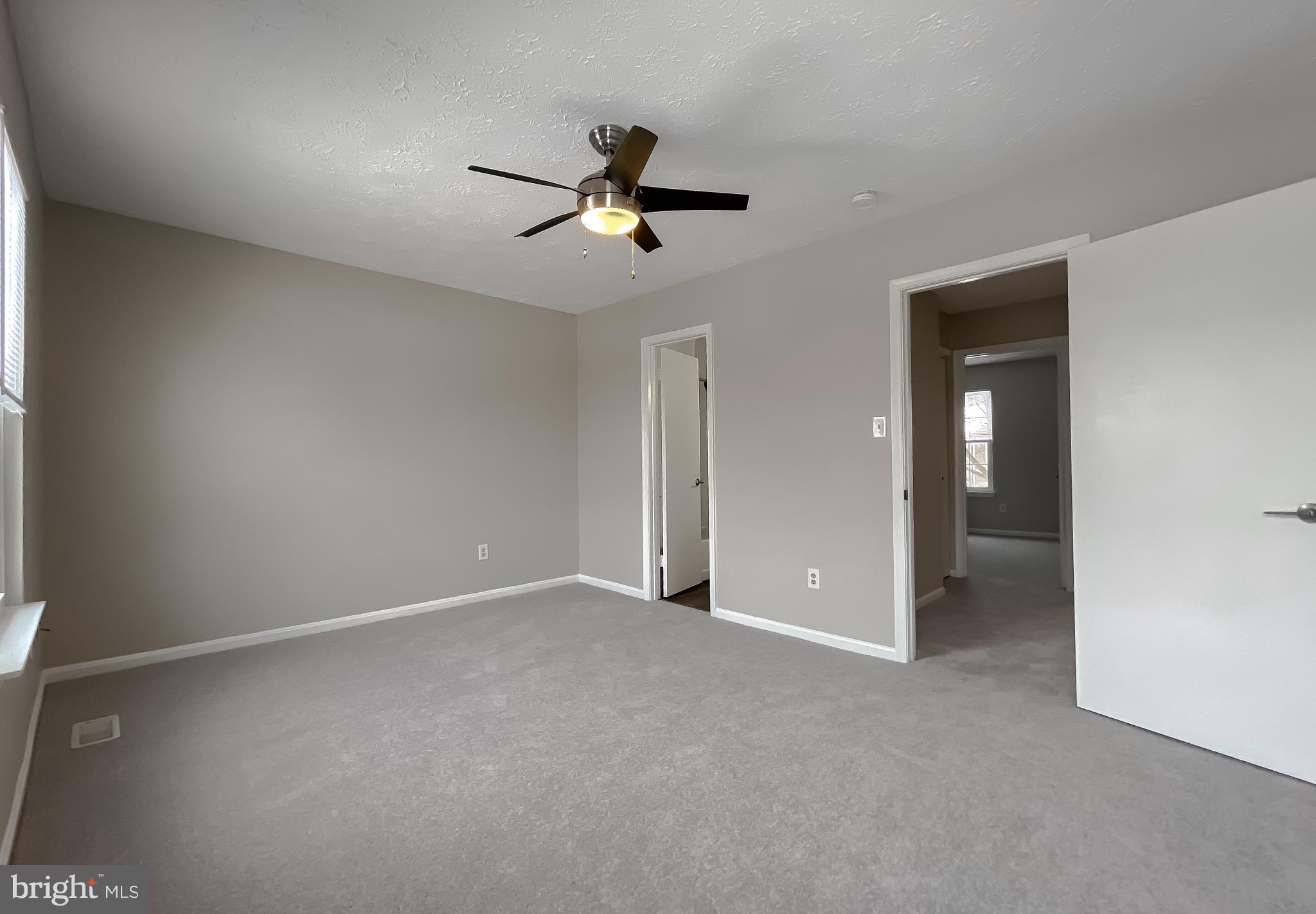 4232 Drake Court Waldorf, MD 20603 - Photo 19 of 25 an empty room with closet and windows