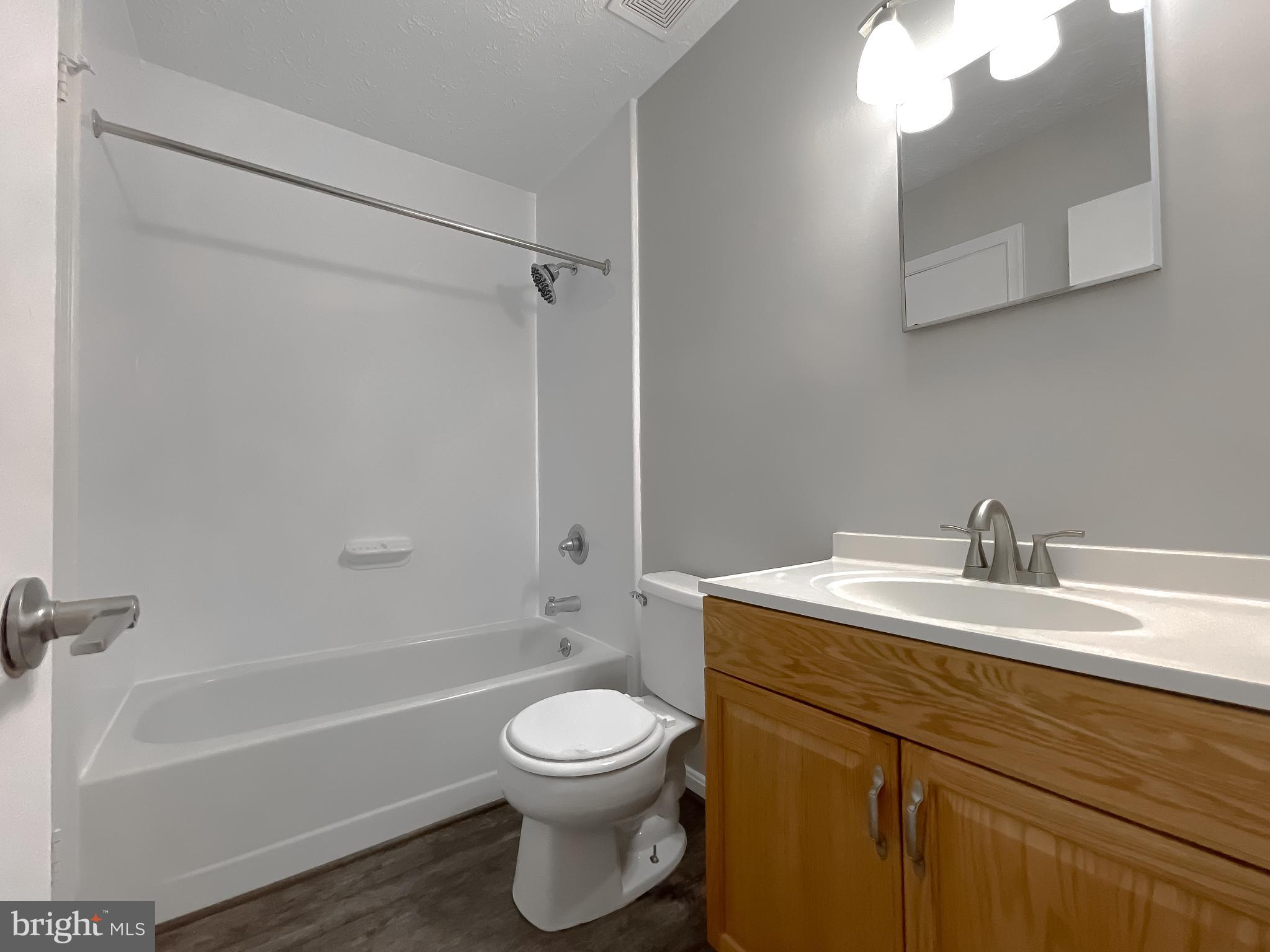 4232 Drake Court Waldorf, MD 20603 - Photo 22 of 25 a bathroom with a sink a toilet and shower