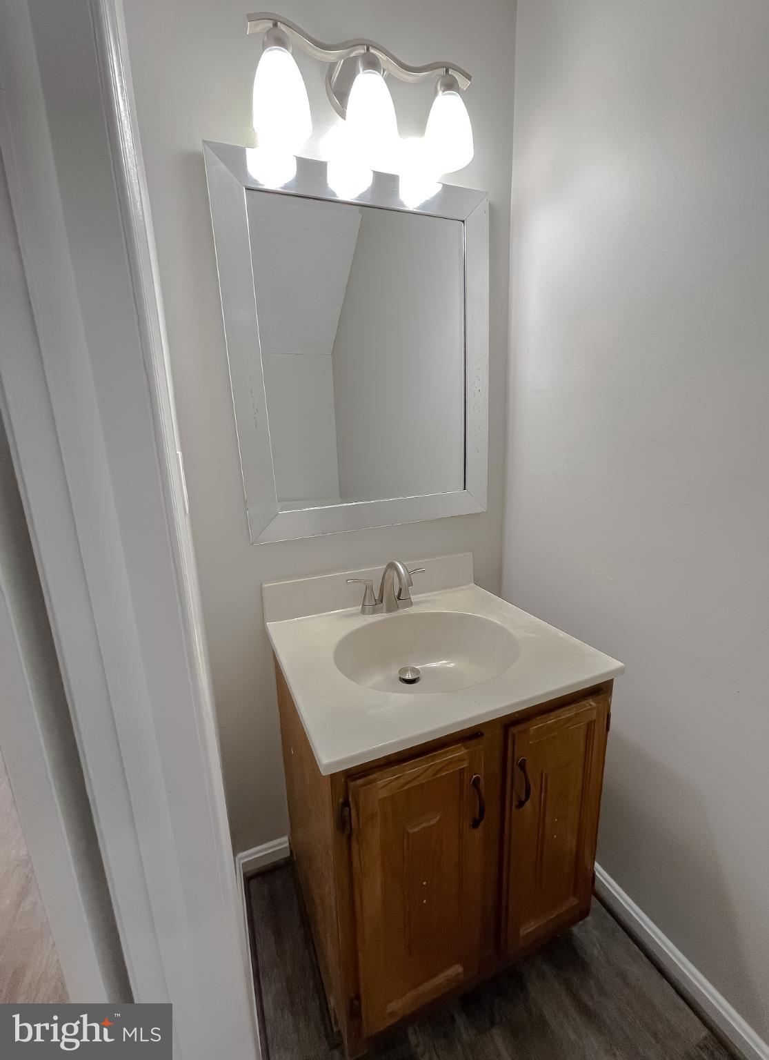 4232 Drake Court Waldorf, MD 20603 - Photo 5 of 25 a bathroom with a sink and a mirror