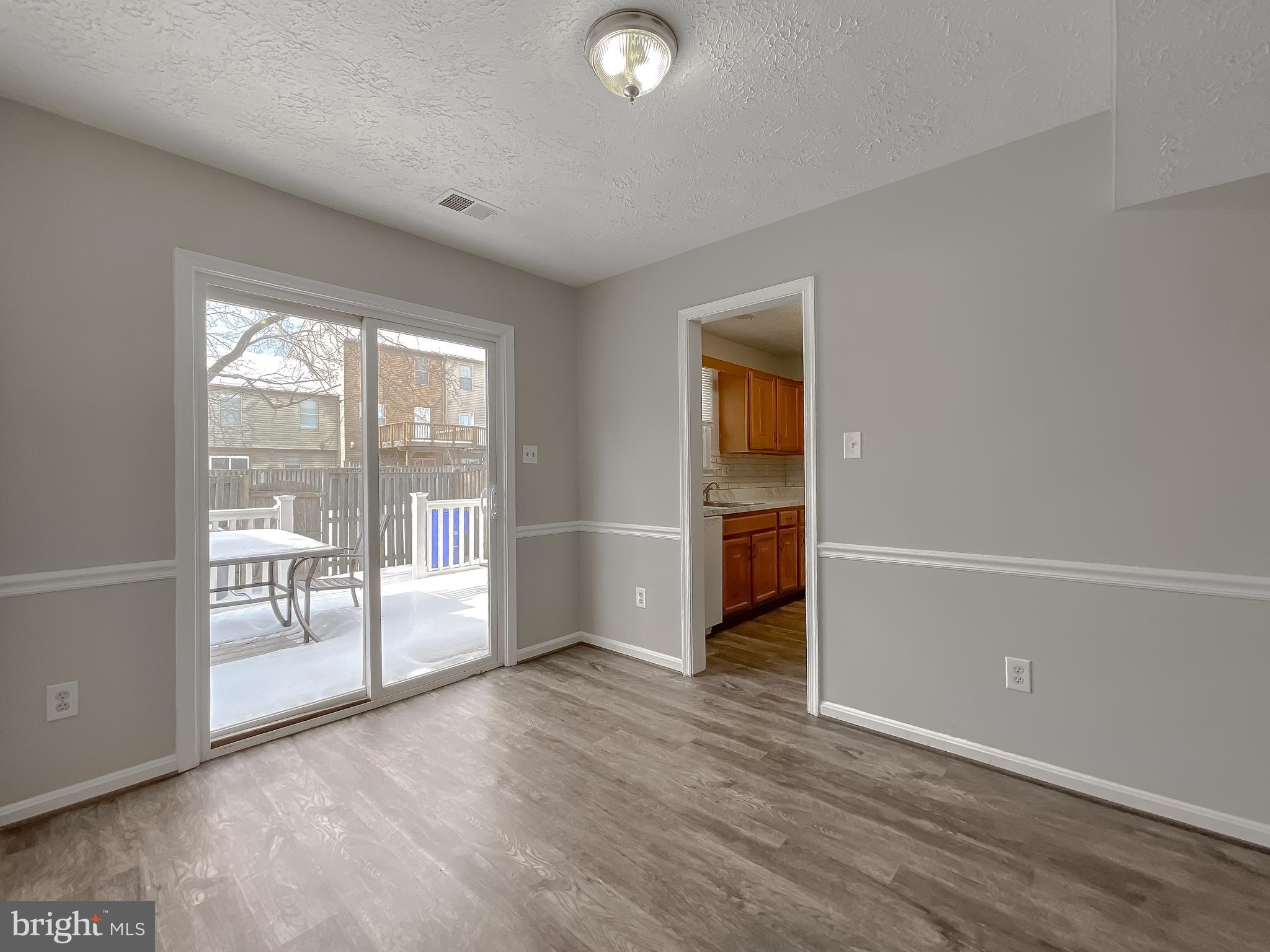 4232 Drake Court Waldorf, MD 20603 - Photo 6 of 25 wooden floor in an empty room with a window