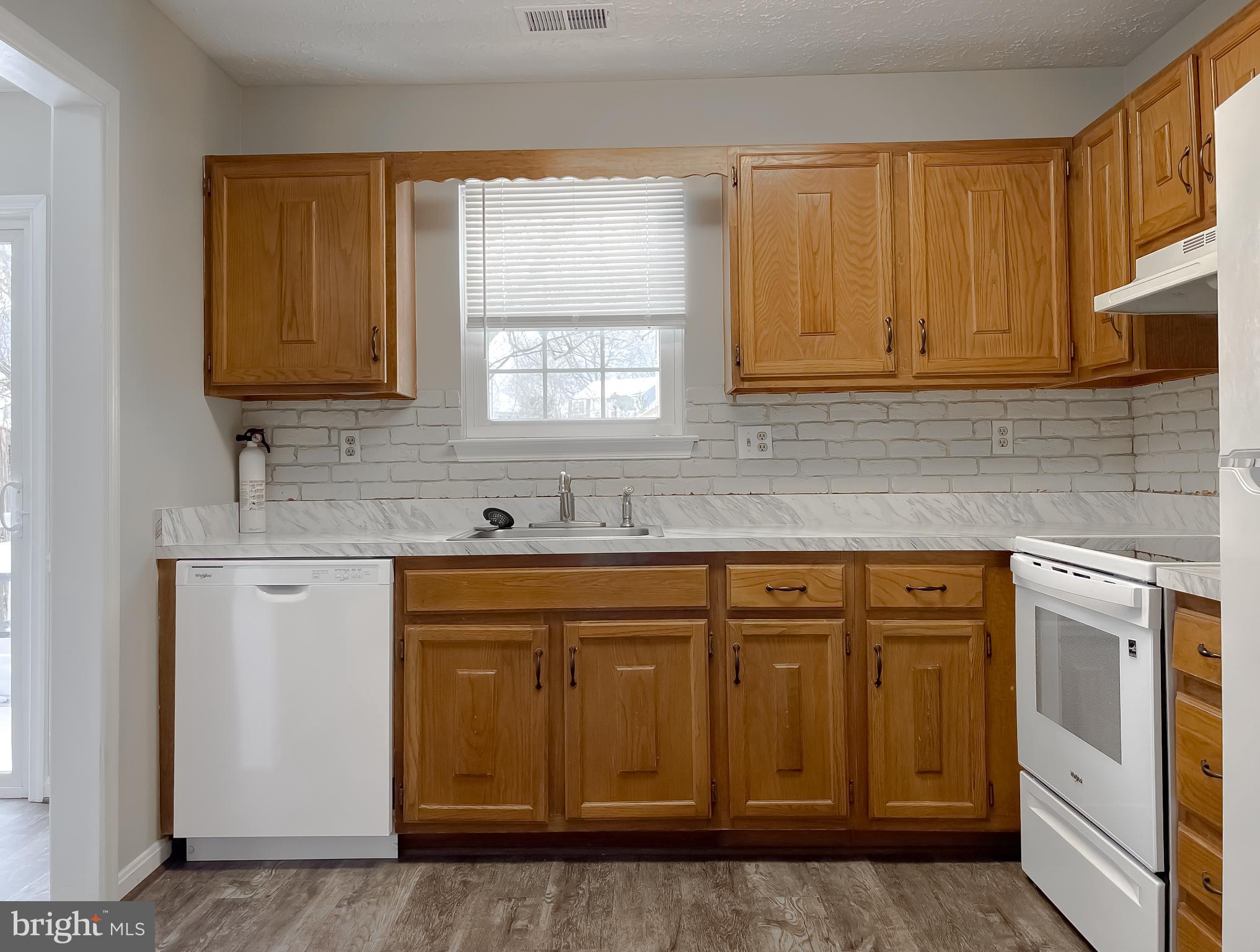 4232 Drake Court Waldorf, MD 20603 - Photo 10 of 25 a kitchen with stainless steel appliances granite countertop a sink and cabinets