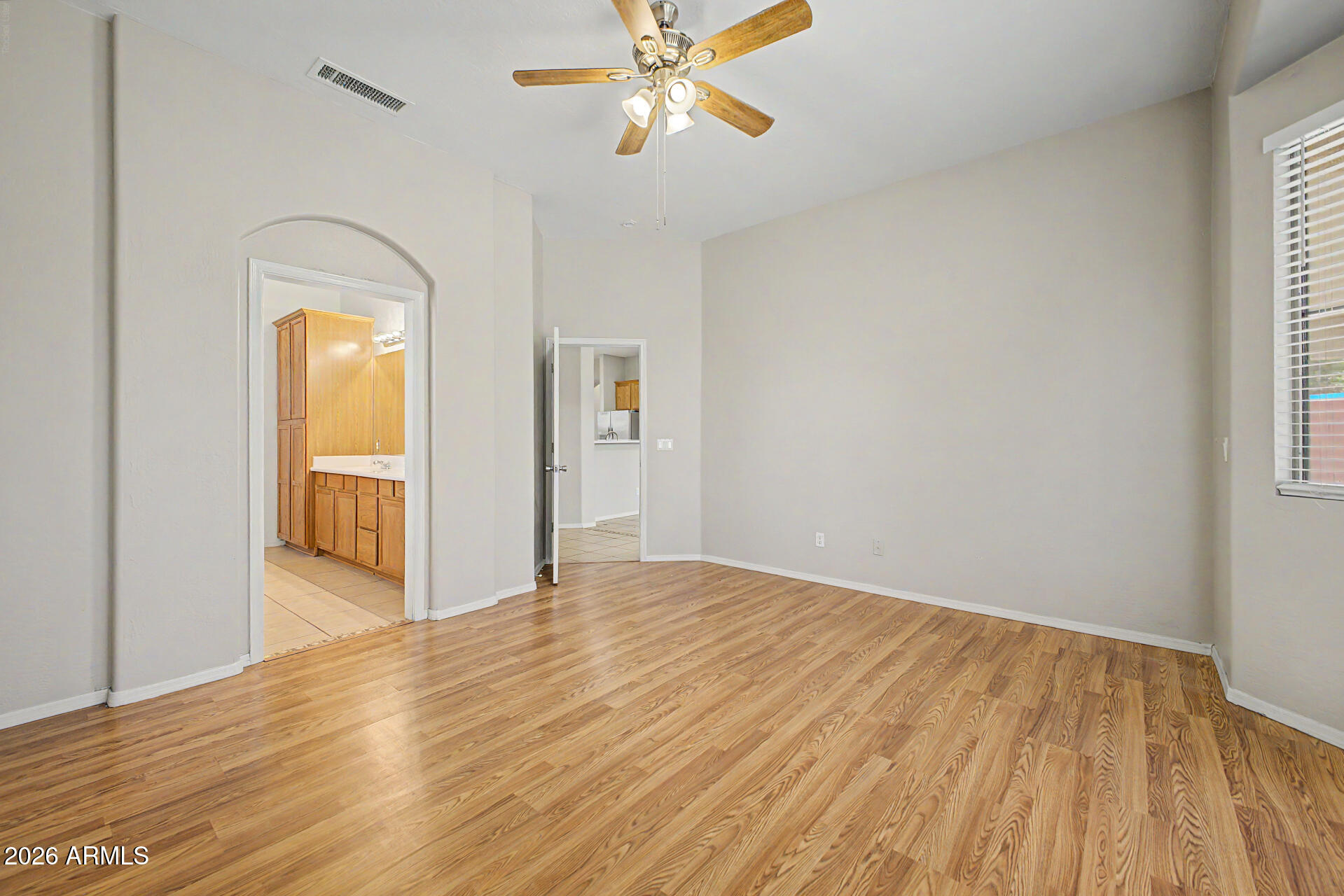 11199 West Monte Vista Road Avondale, AZ 85392 - Photo 16 of 36 a view of empty room with wooden floor and fan