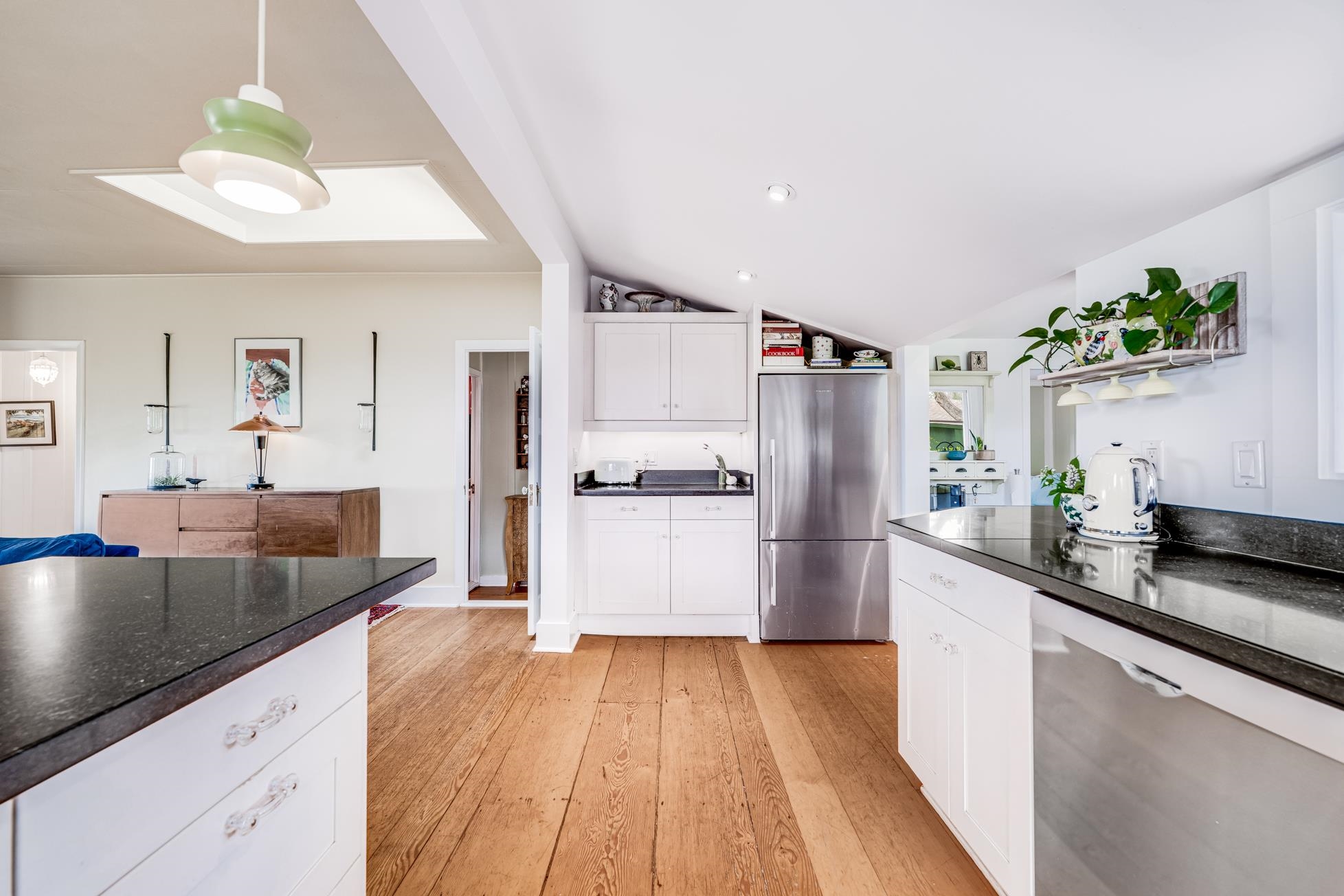 505 Alae Road Kula, HI 96790 - Photo 11 of 36 a large kitchen with a center island wooden floor stainless steel appliances and cabinets