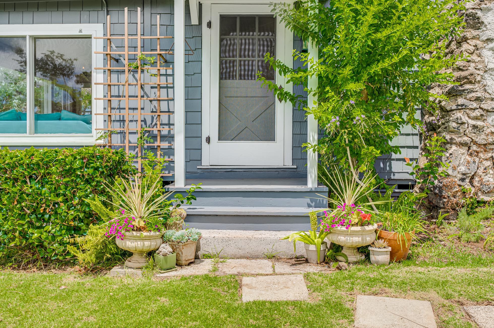 505 Alae Road Kula, HI 96790 - Photo 3 of 36 a front view of a house with a yard