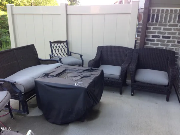 a view of house with a backyard