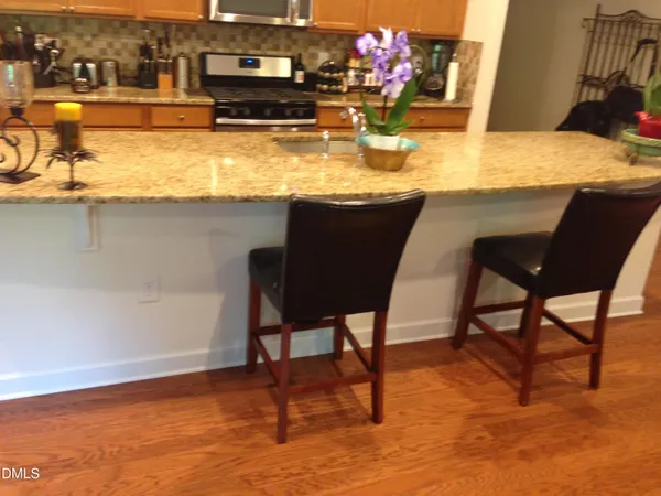 a view of kitchen island dining table and chairs