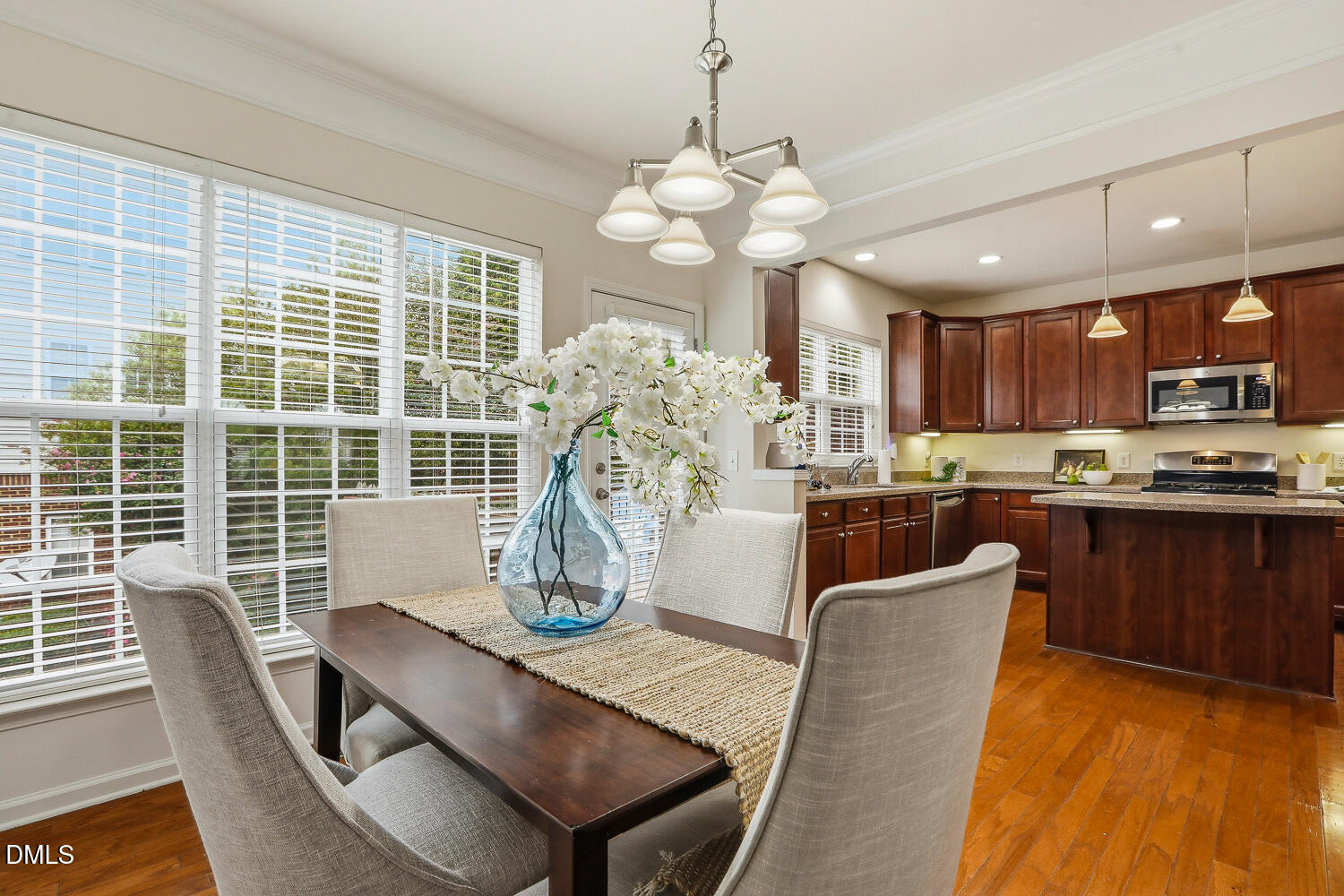 2510 Silverpalm Street Raleigh, NC 27612 - Photo 14 of 65 a view of a dining room with furniture window and wooden floor