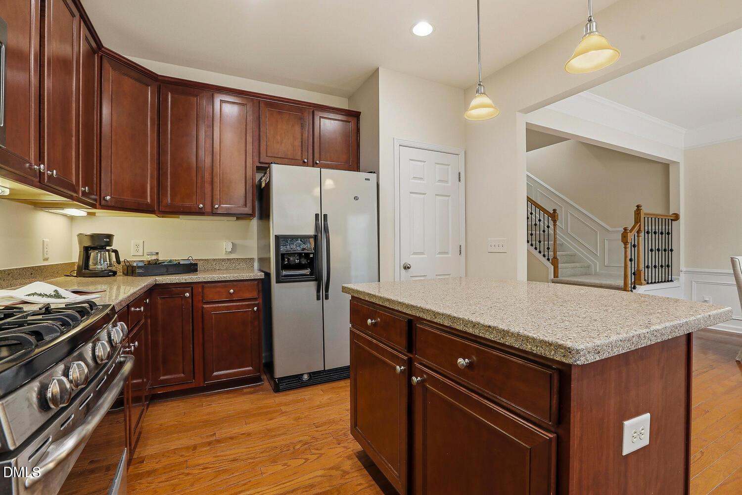 2510 Silverpalm Street Raleigh, NC 27612 - Photo 22 of 65 a kitchen with stainless steel appliances granite countertop a stove refrigerator and cabinets