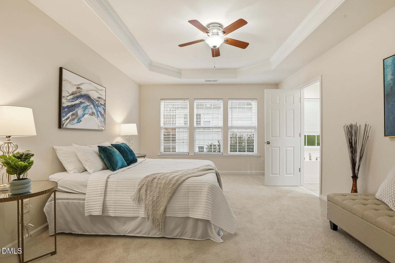 2510 Silverpalm Street Raleigh, NC 27612 - Photo 30 of 65 a spacious bedroom with a large bed and a chandelier