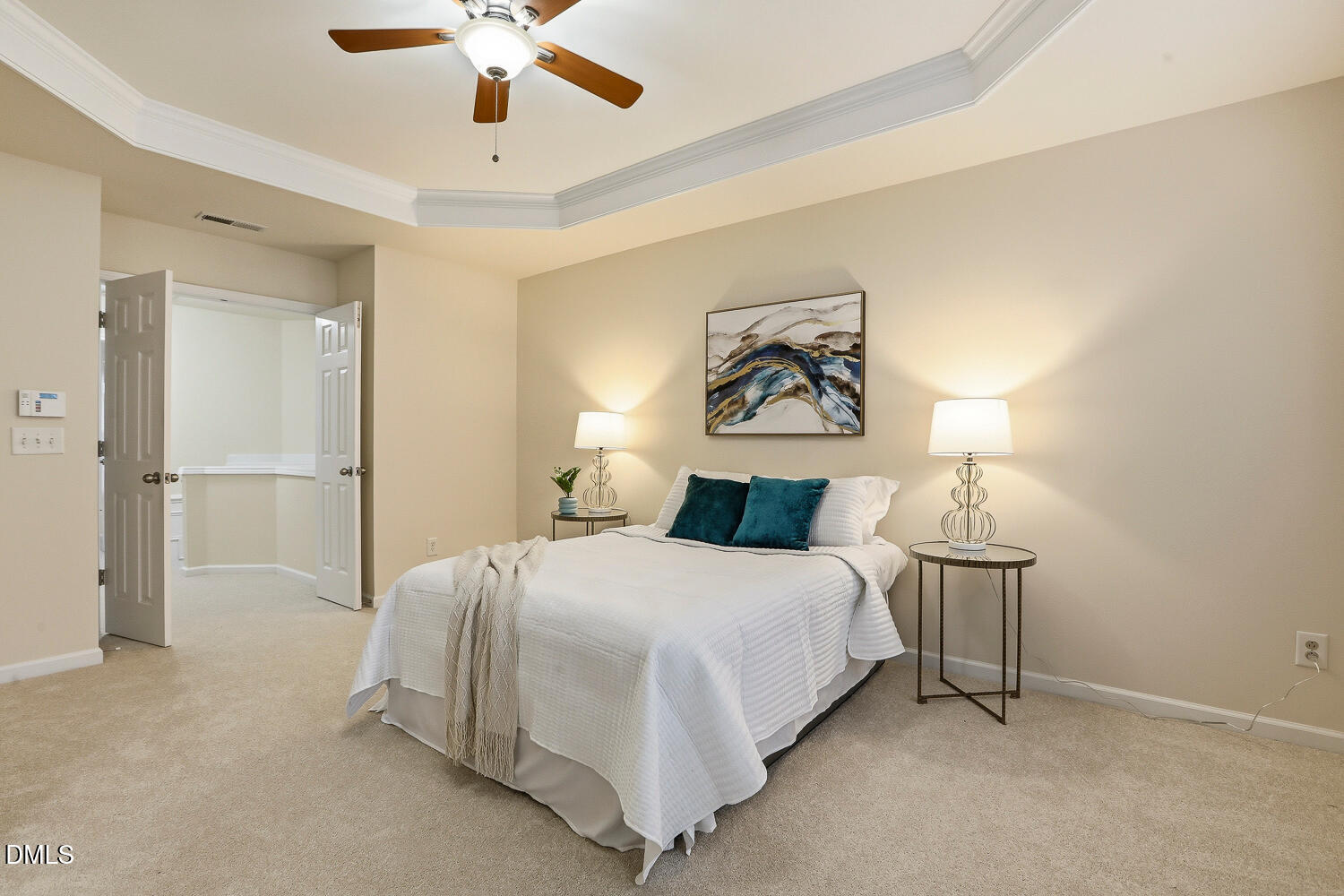 2510 Silverpalm Street Raleigh, NC 27612 - Photo 33 of 65 a spacious bedroom with a bed and a chandelier