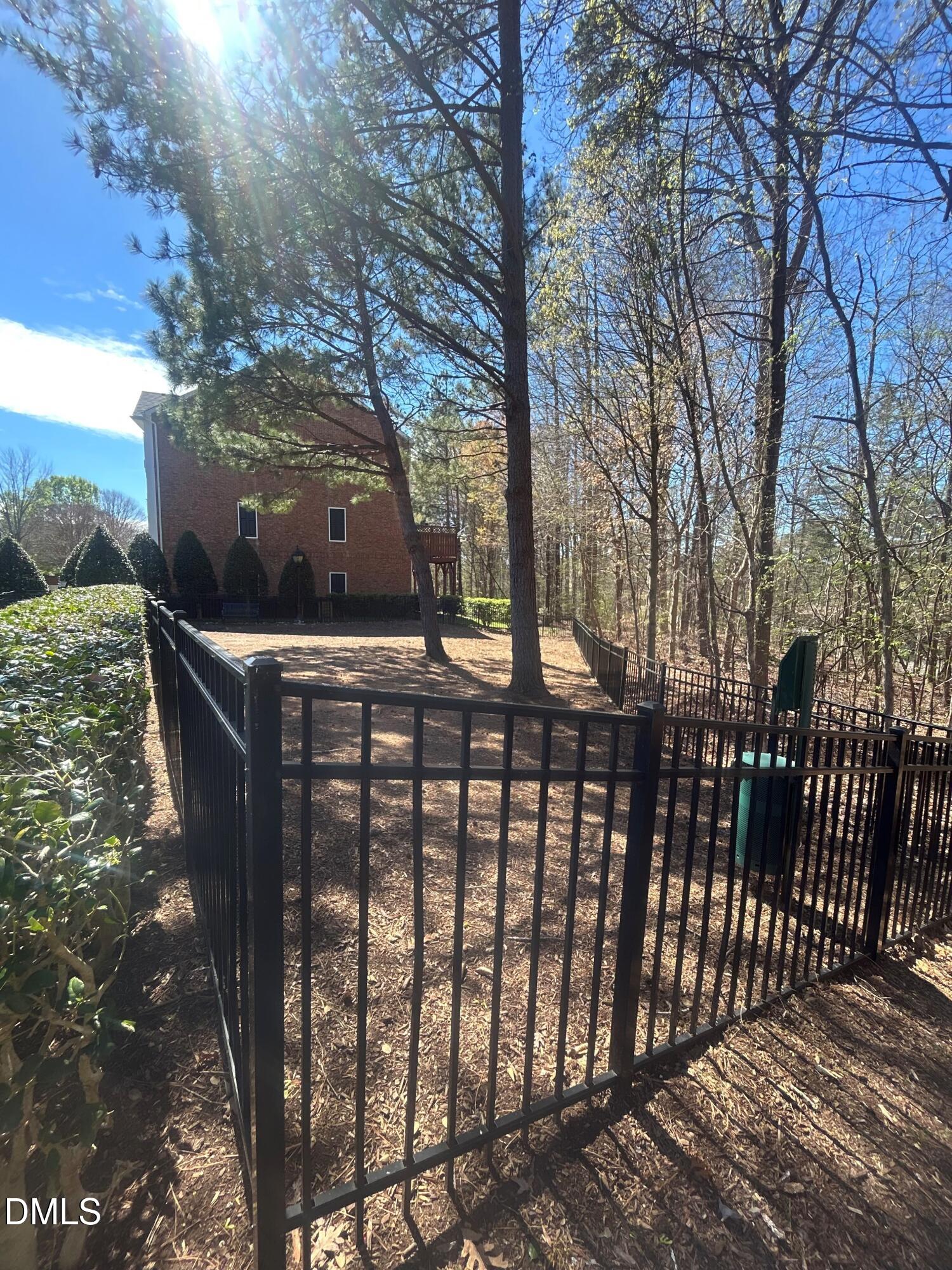 2510 Silverpalm Street Raleigh, NC 27612 - Photo 64 of 65 a view of a street with wooden fence