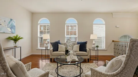 a view of an entryway with wooden floor and windows